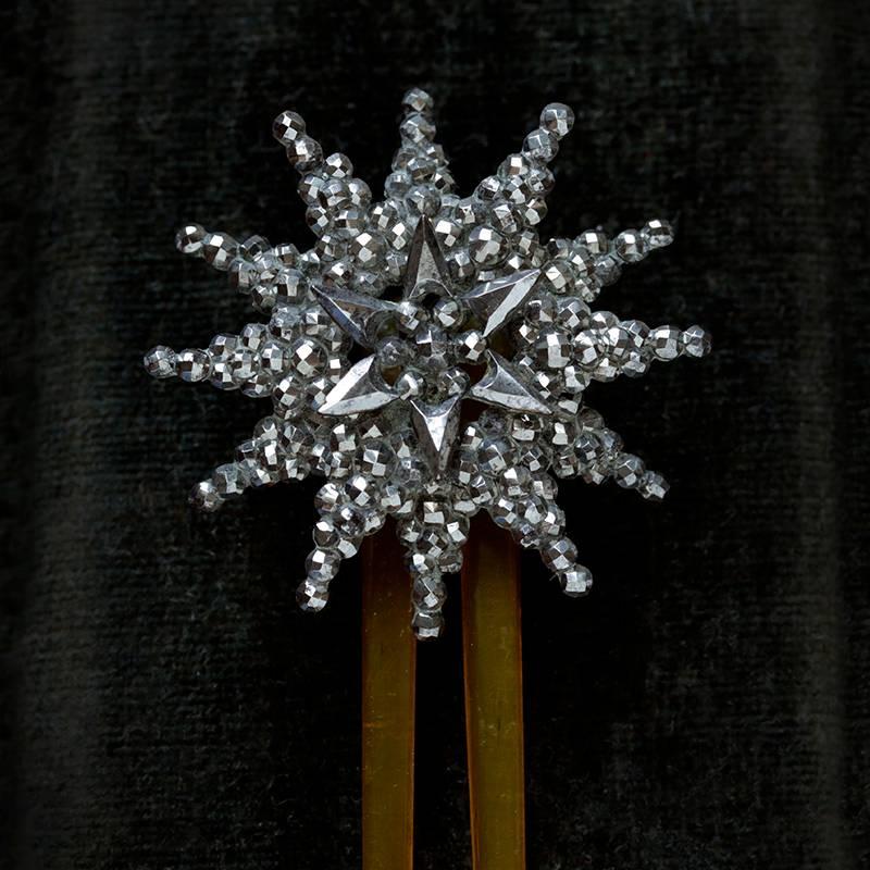 C.1860. A pretty Victorian cut steel Starburst hair comb. The three-tier star glistens beautifully, and it measures approximately 1.5