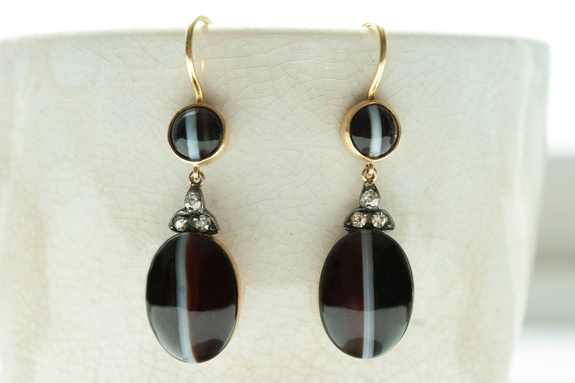 C.1860. Victorian Banded Agate and Diamond Drop Earrings. The pattern of the banded agate cabochons (dark brown/black & white) correspond beautifully. The old-cut diamond connectors in between the cabochons are set in silver on the top, and the