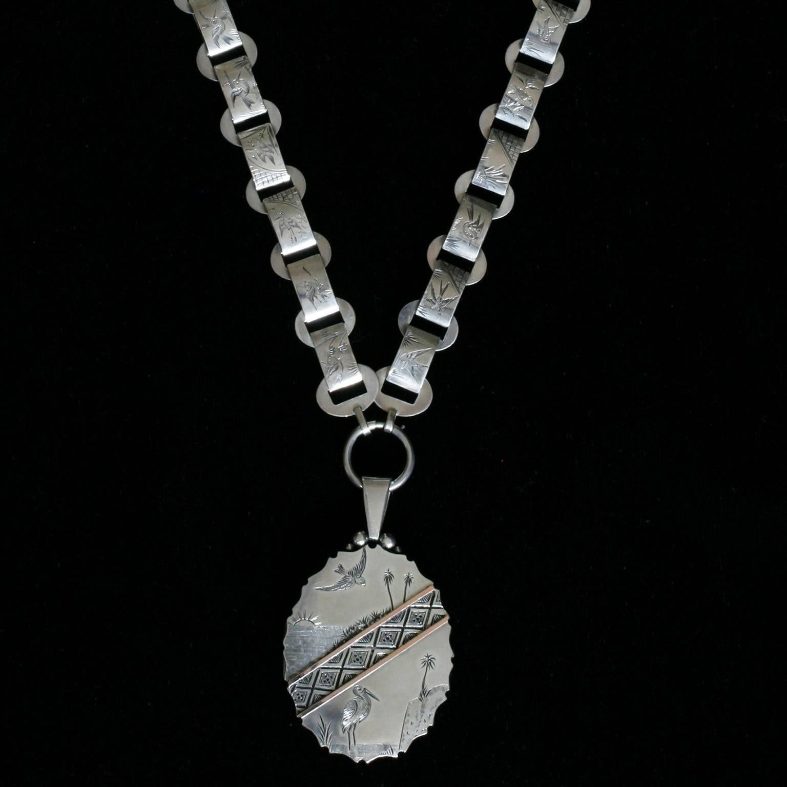 C.1890.  A gorgeous set of late Victorian aesthetic movement sterling silver collar with large silver and gold locket. It is an original matching set, which is fortunate, as with time, the matched set pieces often were separated or damaged, and it