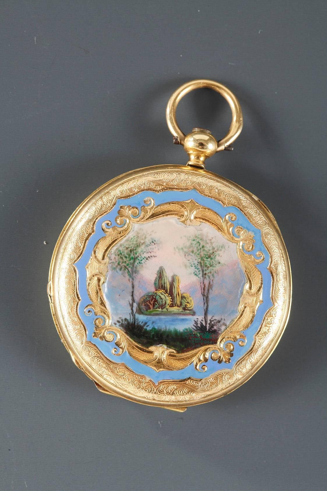 Pendant watch in gold and enamel decorated with an interior scene on one side and a landscape on the other. The scenes are framed in foliage and gold crosshatching on a sky blue background. They are inspired by Jean-Jacques Rouseau’s treatise,