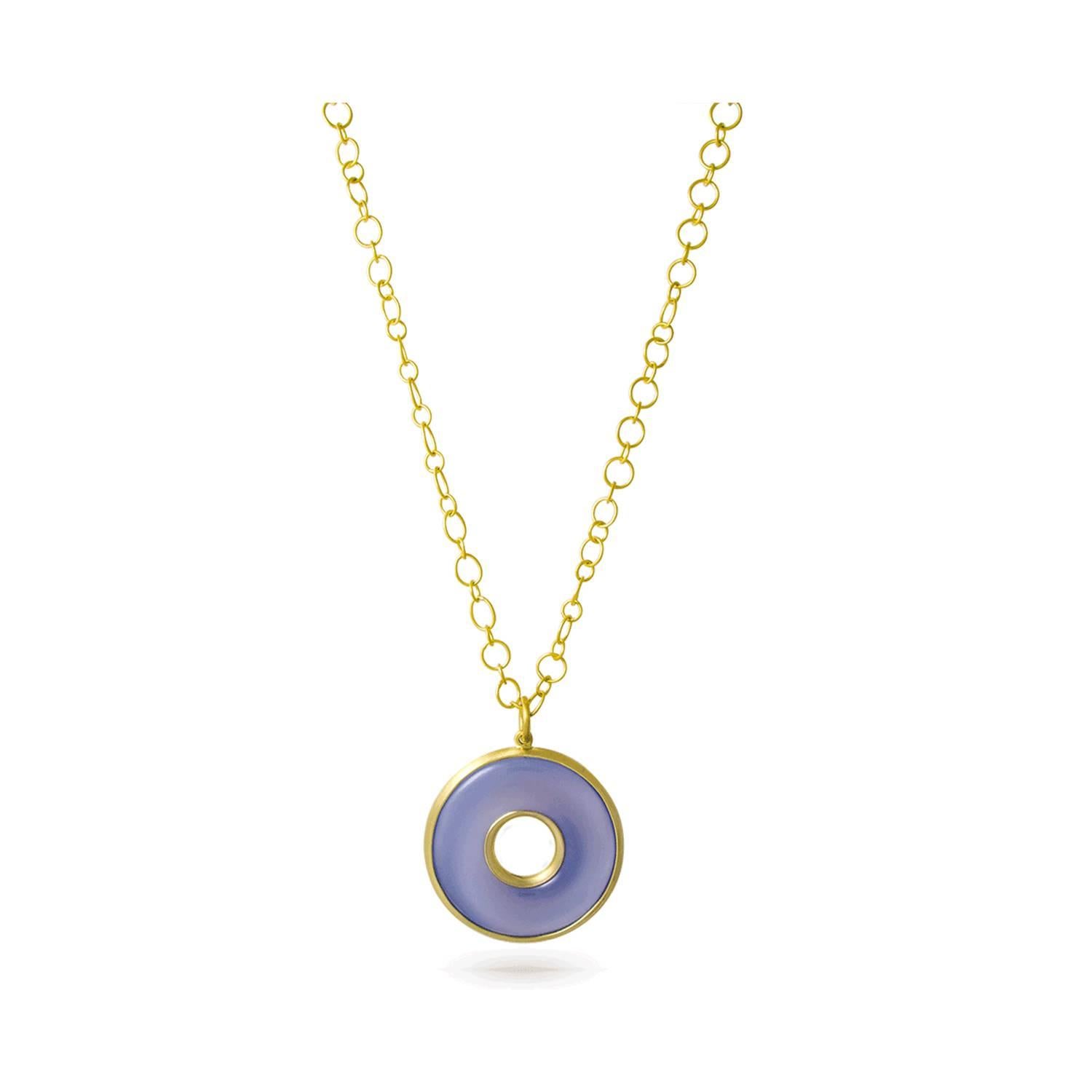 Circle of Life pendant in a soft shade of blue-gray chalcedony is hand-framed in 18k green* gold.   Blue Chalcedony, a member of the quartz family has a quality that is ethereal yet solid. It has an inviting, soft blue translucence, invoking calm