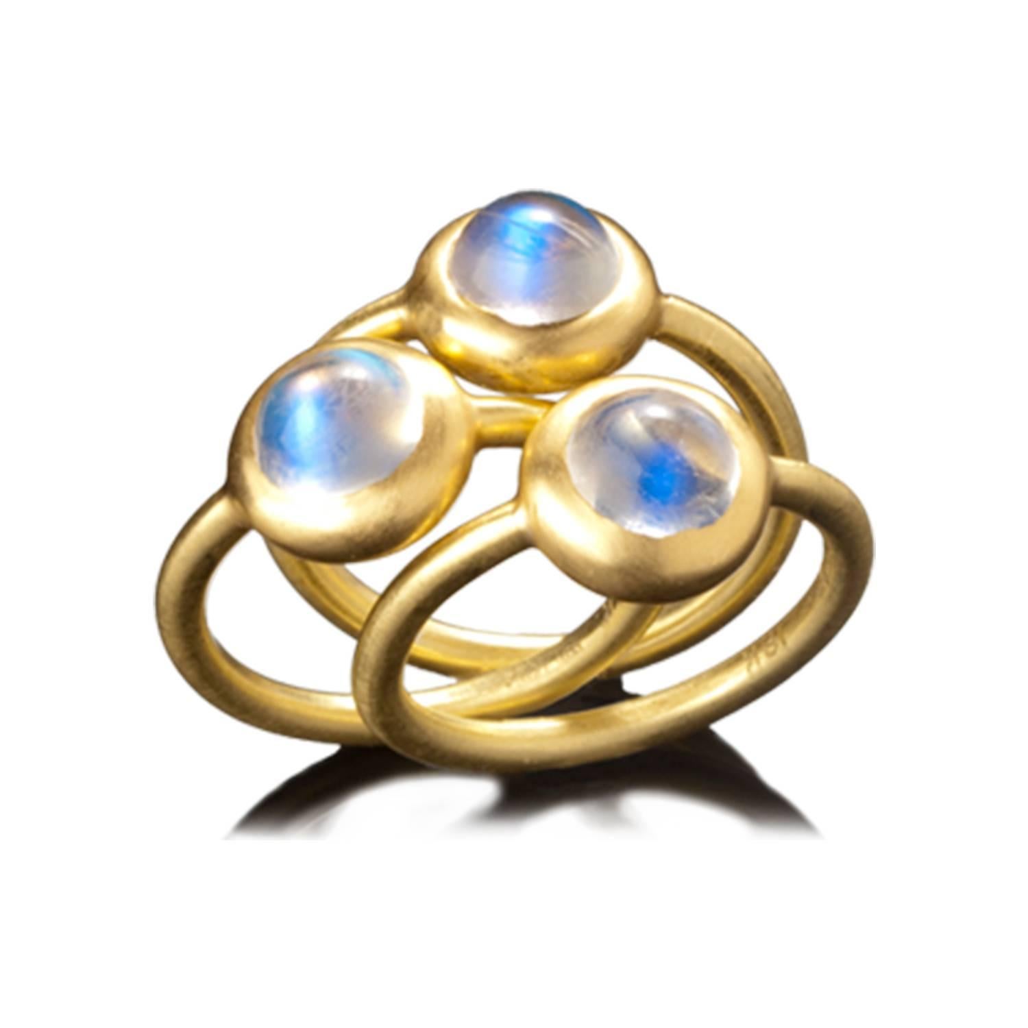 Moonstone has fascinated us for centuries with its remarkable properties of adularescence, the ability of light to enter the stone and create a shimmering  aura. Faye Kim's Ceylon moonstone ring in an 18k gold contemporary setting is simple with a