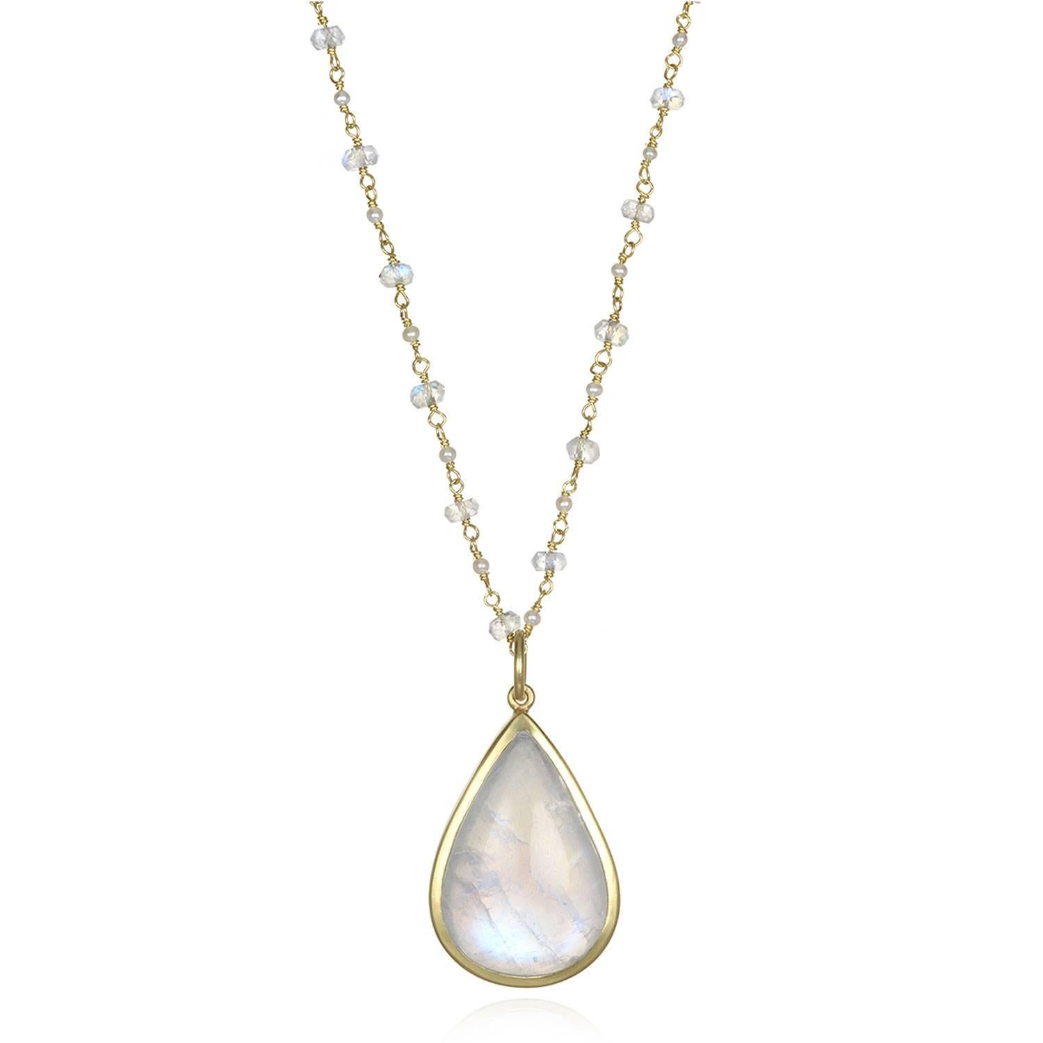 This 36 carat moonstone's iridescent aura will draw you in like a crystal ball.   The moonstone is hand framed in a clean bezel 18K gold* setting showcasing the stone's stand-alone beauty. Known for its adularescence, moonstones offer versatility