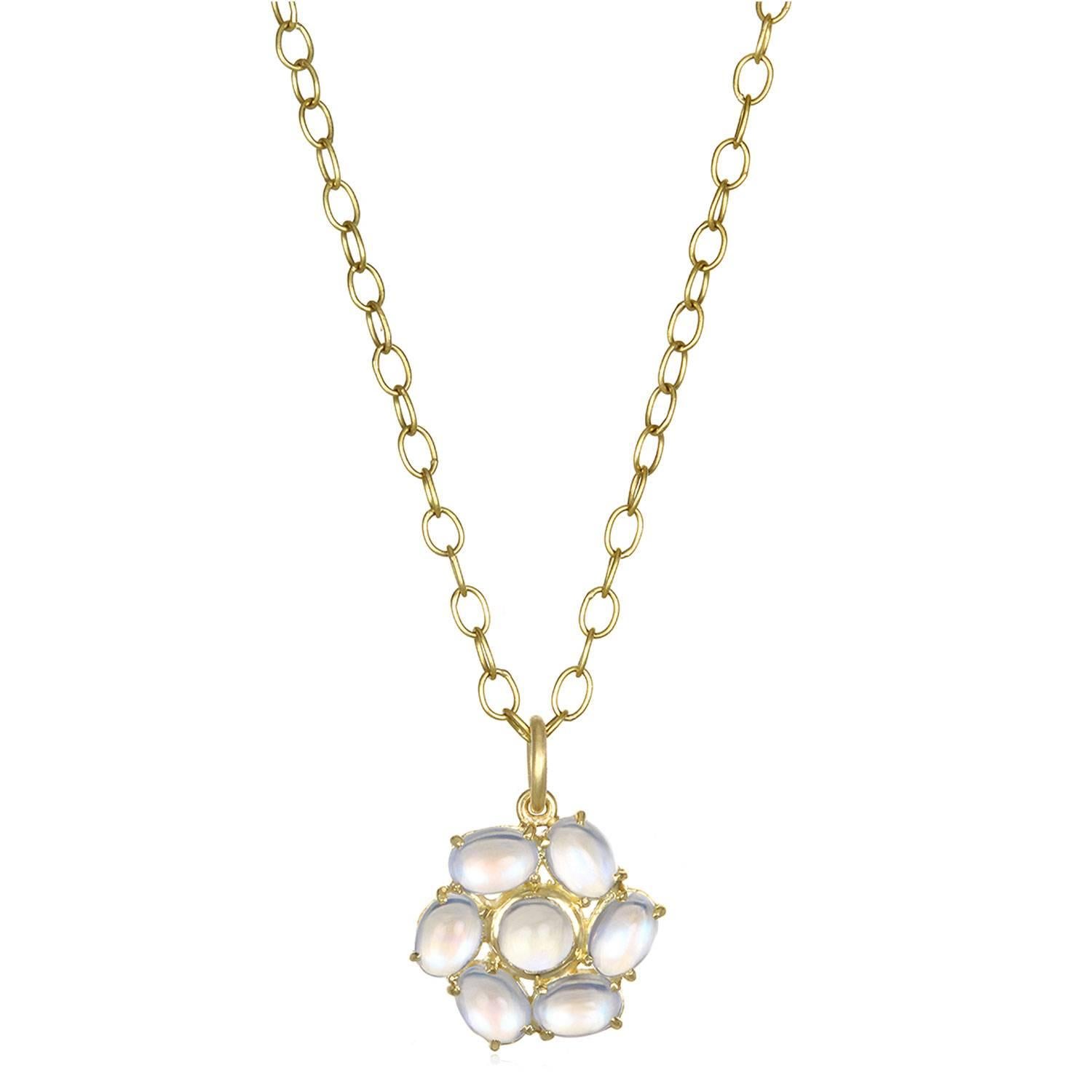 Ceylon Moonstone Daisy Pendant in 18K Gold. Known for its adularescence, the inimitable blue flash from Ceylon moonstones adds to the overall mystique surrounding moonstones. Whether worn long, short or layered, this pendant is wearable and