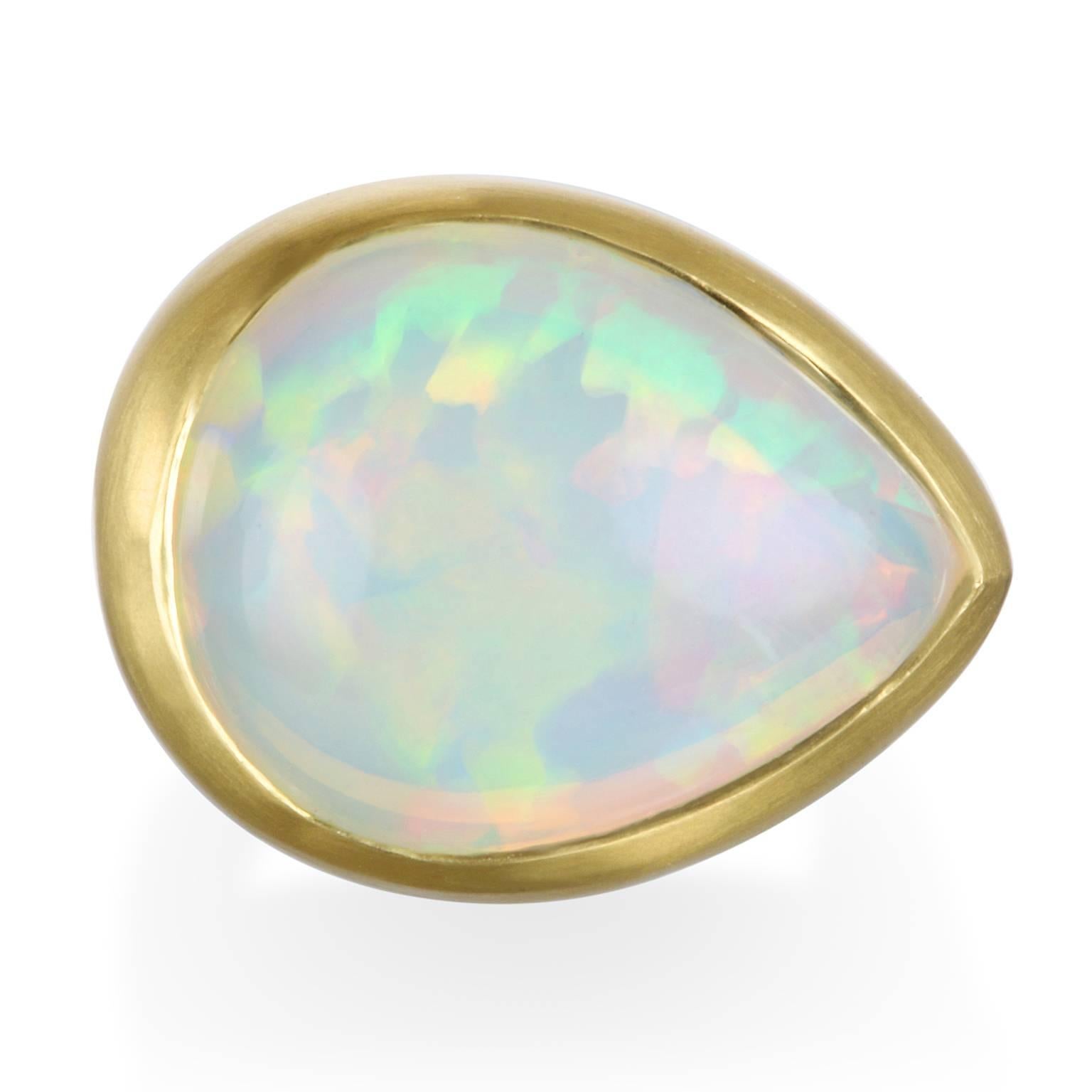 Spectacular in size and color, the pear shape Ethiopian Opal is set in 18k matte green gold to further enhance its play of color.  The ring is skillfully handcrafted for beauty and comfort - the ultimate modern-day cocktail ring.

Ring Size:
