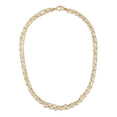 Collana Faye Kim in oro 18 carati con perle naturali avvolte a mano