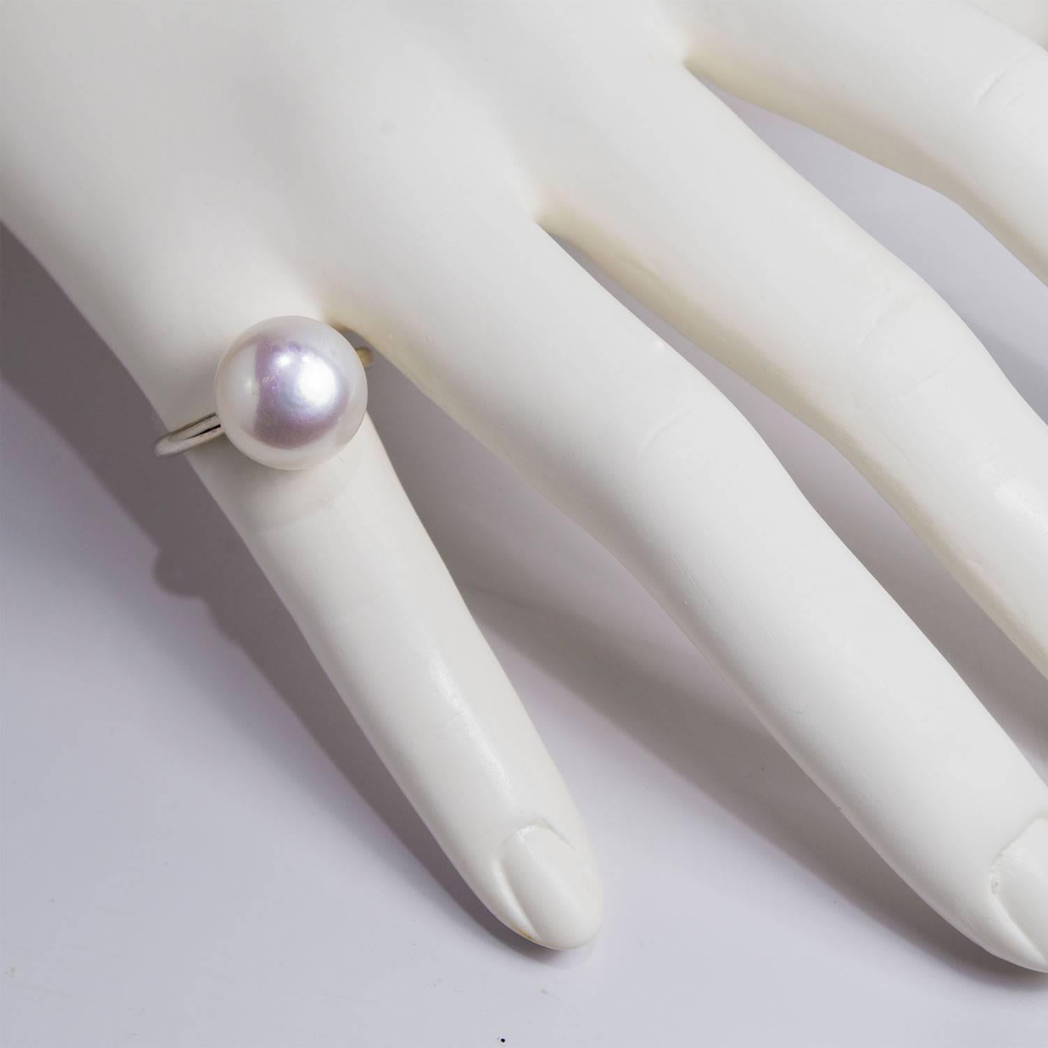 Whether your look is classic and elegant or casual and chic, Faye Kim's single pearl ring is the perfect accessory!  Wear alone or stack a few to create your own, unique style.  The white freshwater pearl is button-shaped and generous in size with