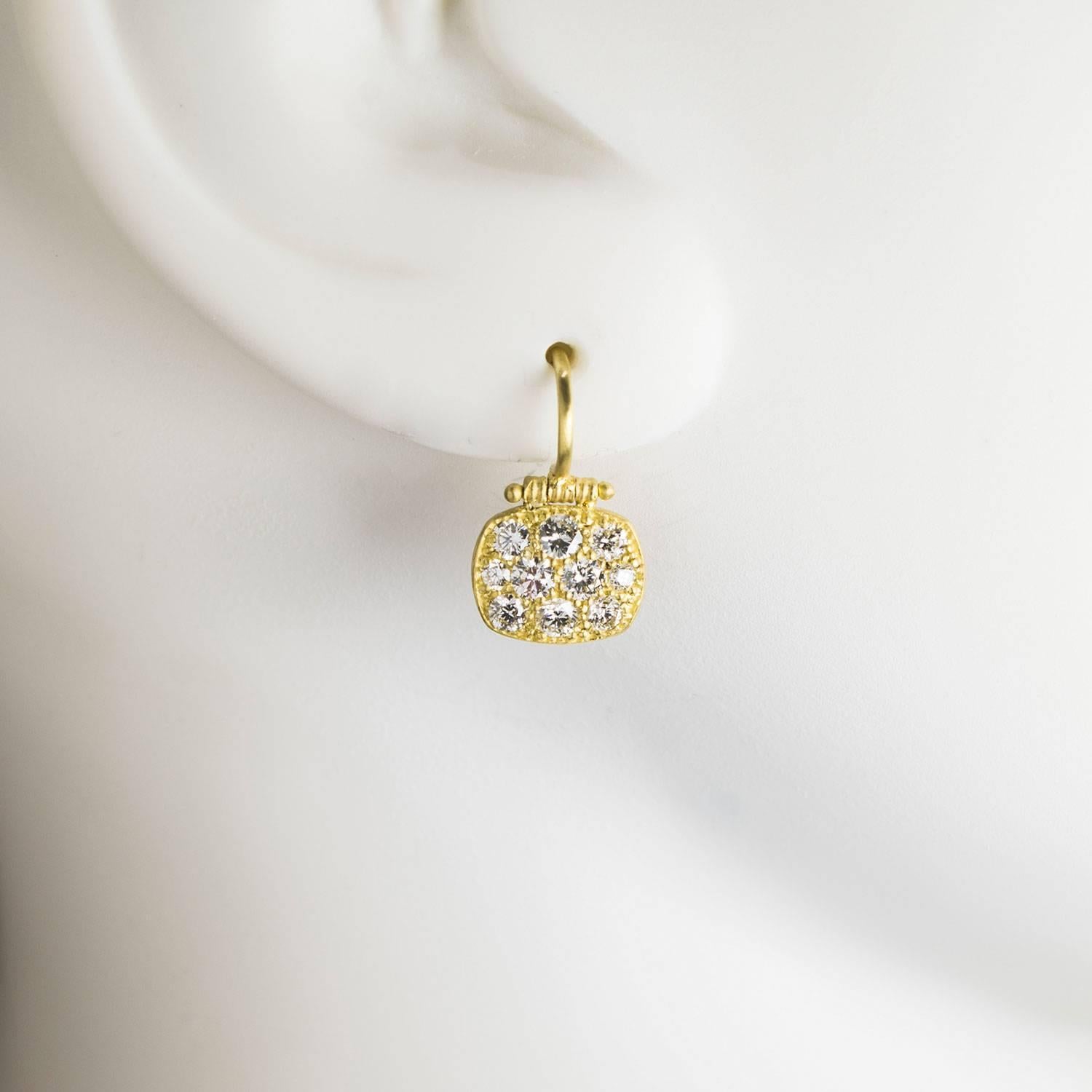The hinge movement enhances the bright sparkle of the diamonds on these earrings. Handcrafted in 18k green* gold, ; the chicklet shape is aesthetically pleasing and very flattering. The perfect diamond drop earring! Total weight of diamonds 1.15