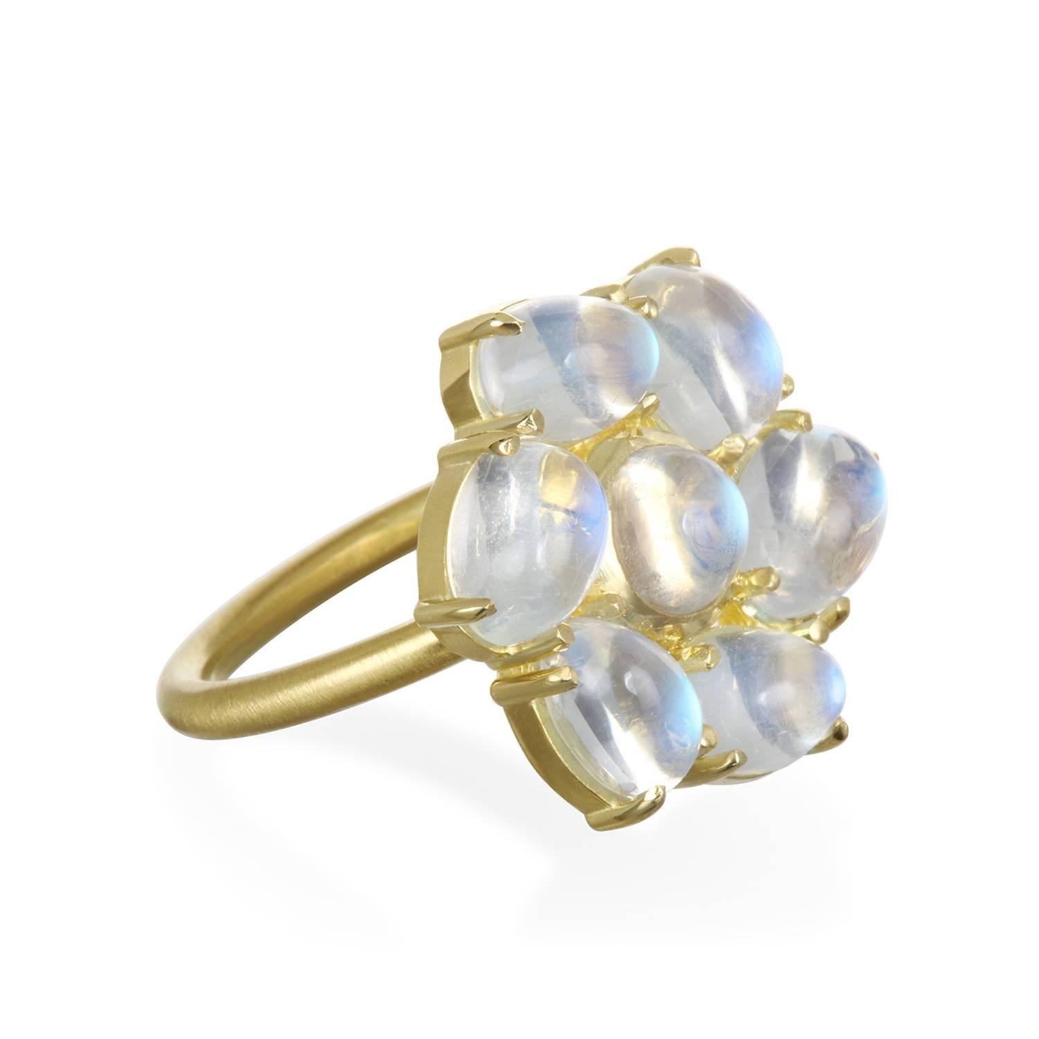 Take a walk on the glamorous side with this moonstone daisy ring.  Size, comfort, and beauty come together in the daisy ring that looks great worn on any finger.  Known for its adularescence, the inimitable blue flash from Ceylon moonstones adds to