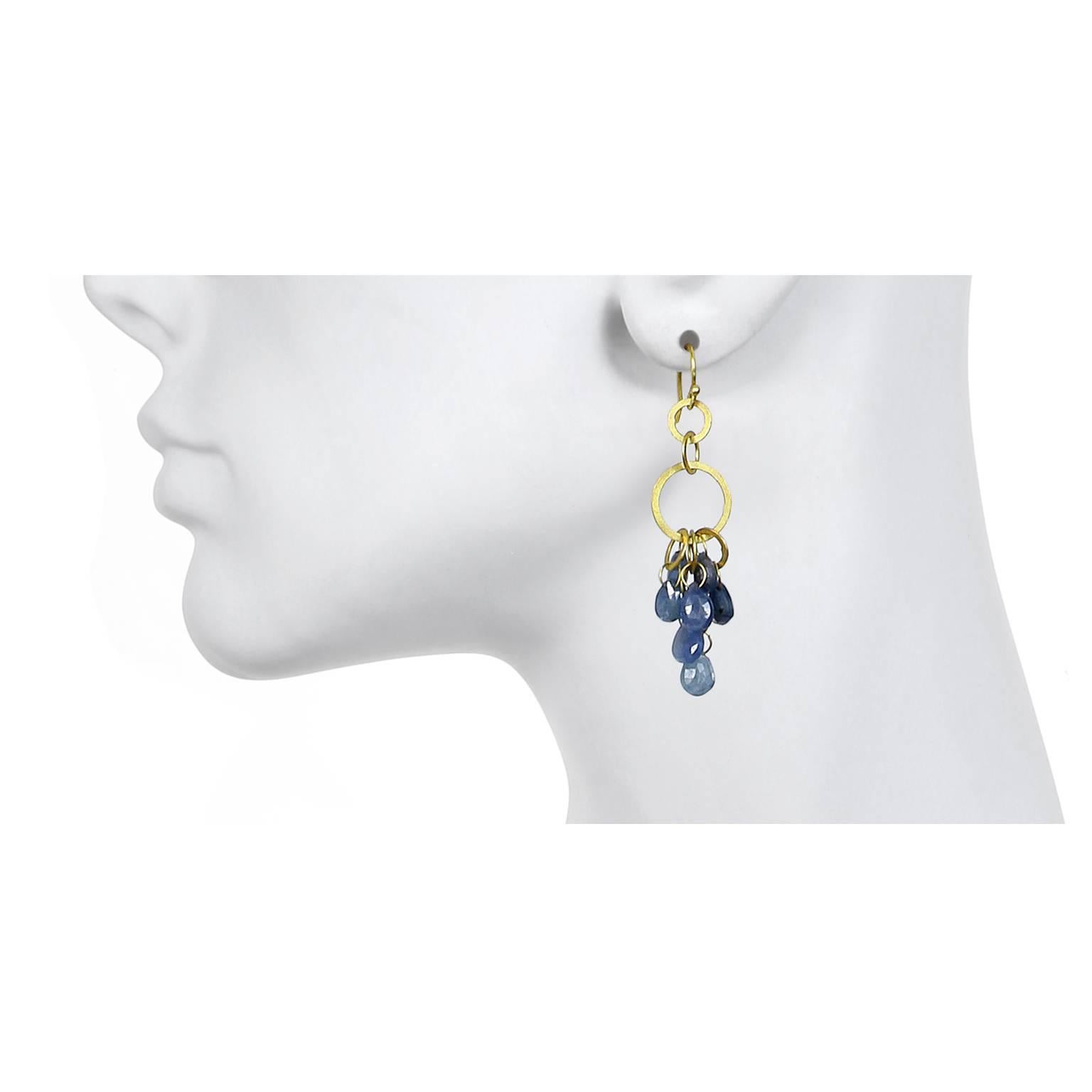 Handcrafted in signature 18k green* gold, this multi-loop, umba blue sapphire earrings feature planished gold circles giving texture and dimension.  Super lightweight with just the right amount of swing.  Pair these with your favorite shift dress