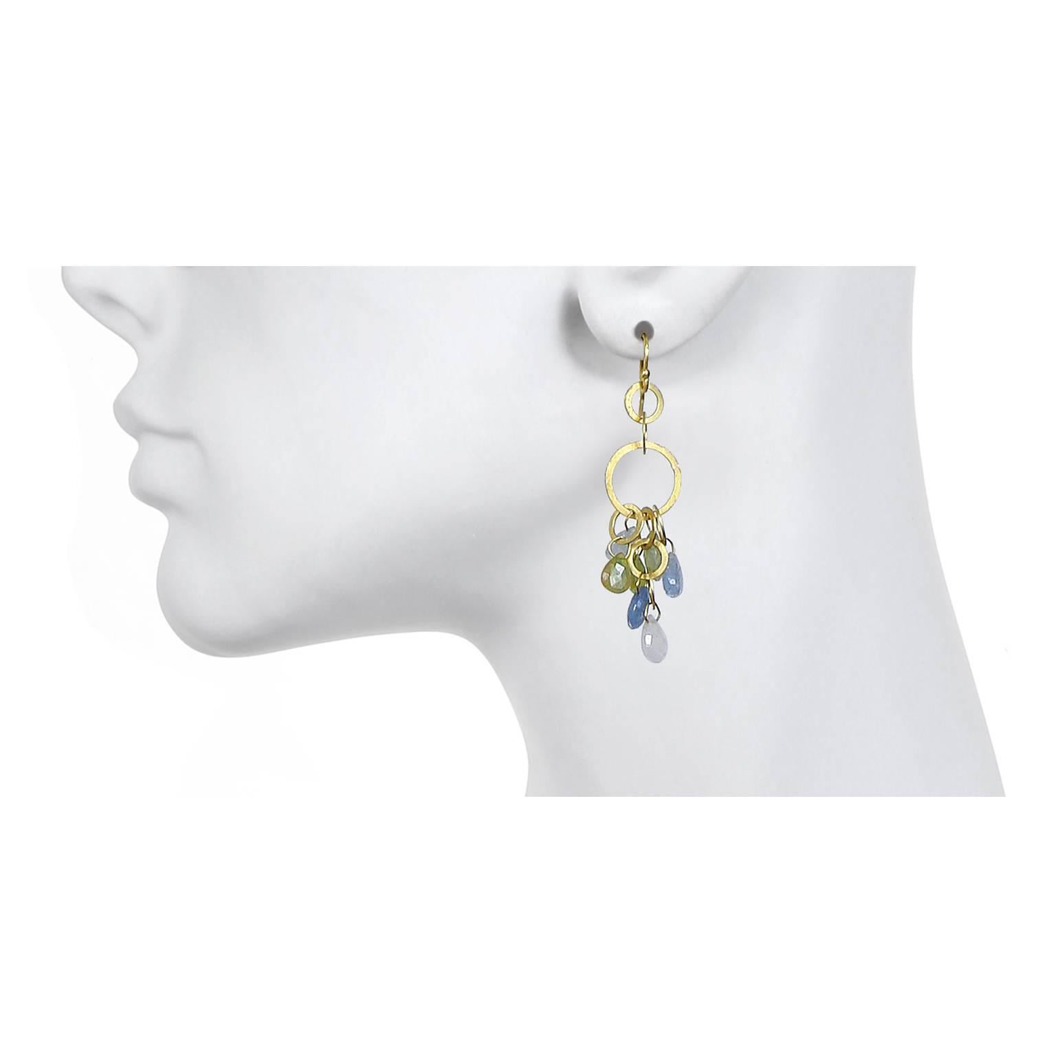 A perennial favorite!  Earrings in 18k gold featuring planished rings and Umba sapphire briolettes. Fun, versatile, and lightweight, these earrings with multi-color sapphires can easily shift from workweek to weekend in a snap.

Length: 2