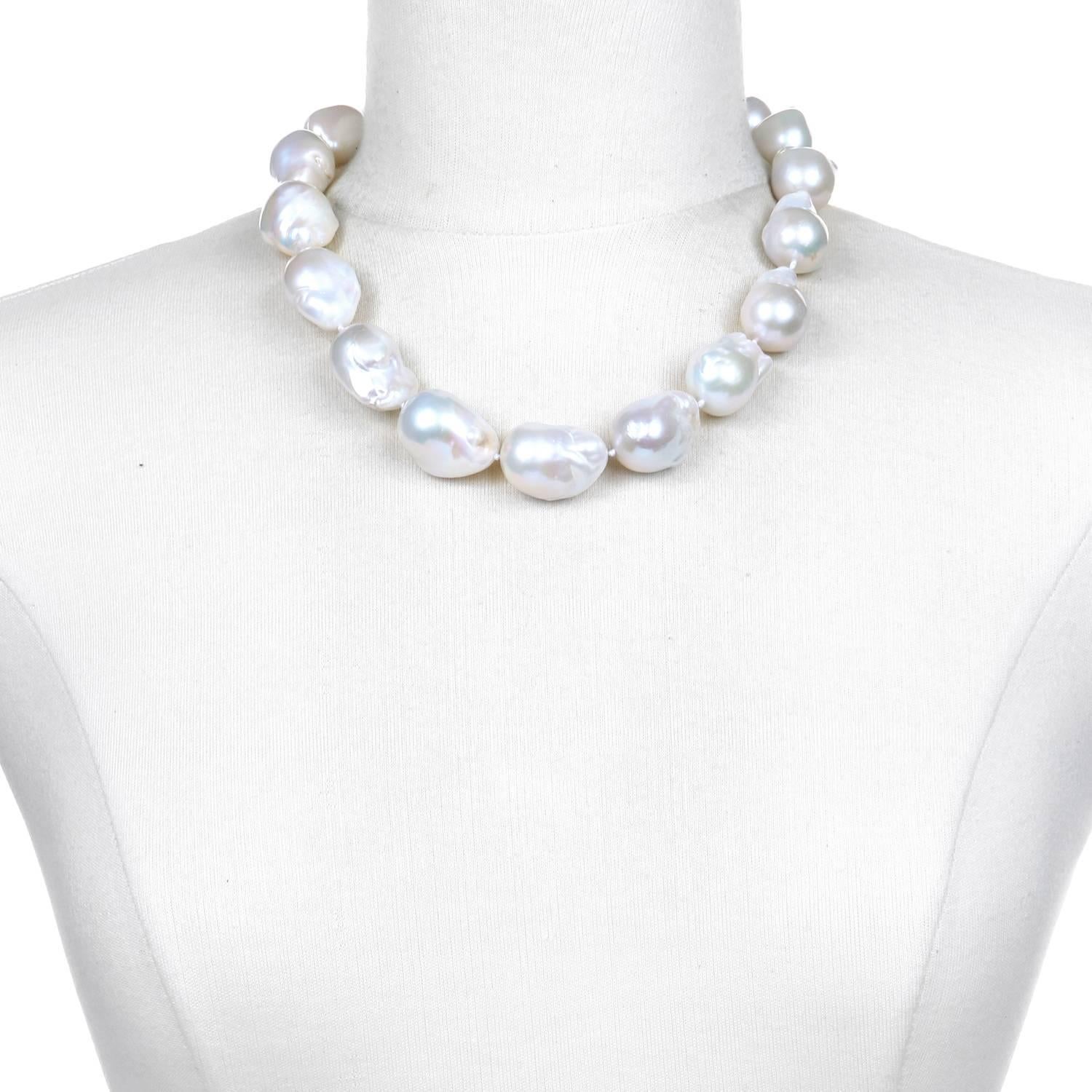 A classic beauty!  Slightly graduated, white freshwater baroque cultured pearl choker is simply knotted and finished with a handmade 18k gold* clasp.

Whether your style leans traditional, contemporary or modern, this pearl choker is the ultimate,