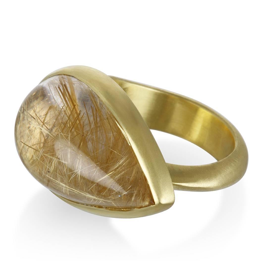 
Rutilated Quartz is one of the few gemstones prized for its inclusions. The golden Rutile needles radiate a warm glow from within making this ring sensational in every way.  Boldly chic and sophisticated, the ring is a true one-of-a-kind statement