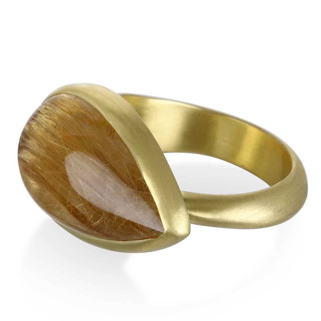 Rutilated Quartz is one of the few gemstones prized for its inclusions. The golden Rutile needles radiate a warm glow from within making this ring sensational in every way.  Boldly chic and sophisticated, the ring is a true one-of-a-kind statement