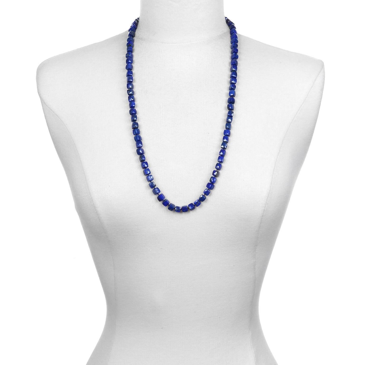 Faye Kim's vibrant blue Lapis Lazuli cube necklace is hand knotted and finished with silk ties.  A modern take on bead necklaces, the silk ties are 12