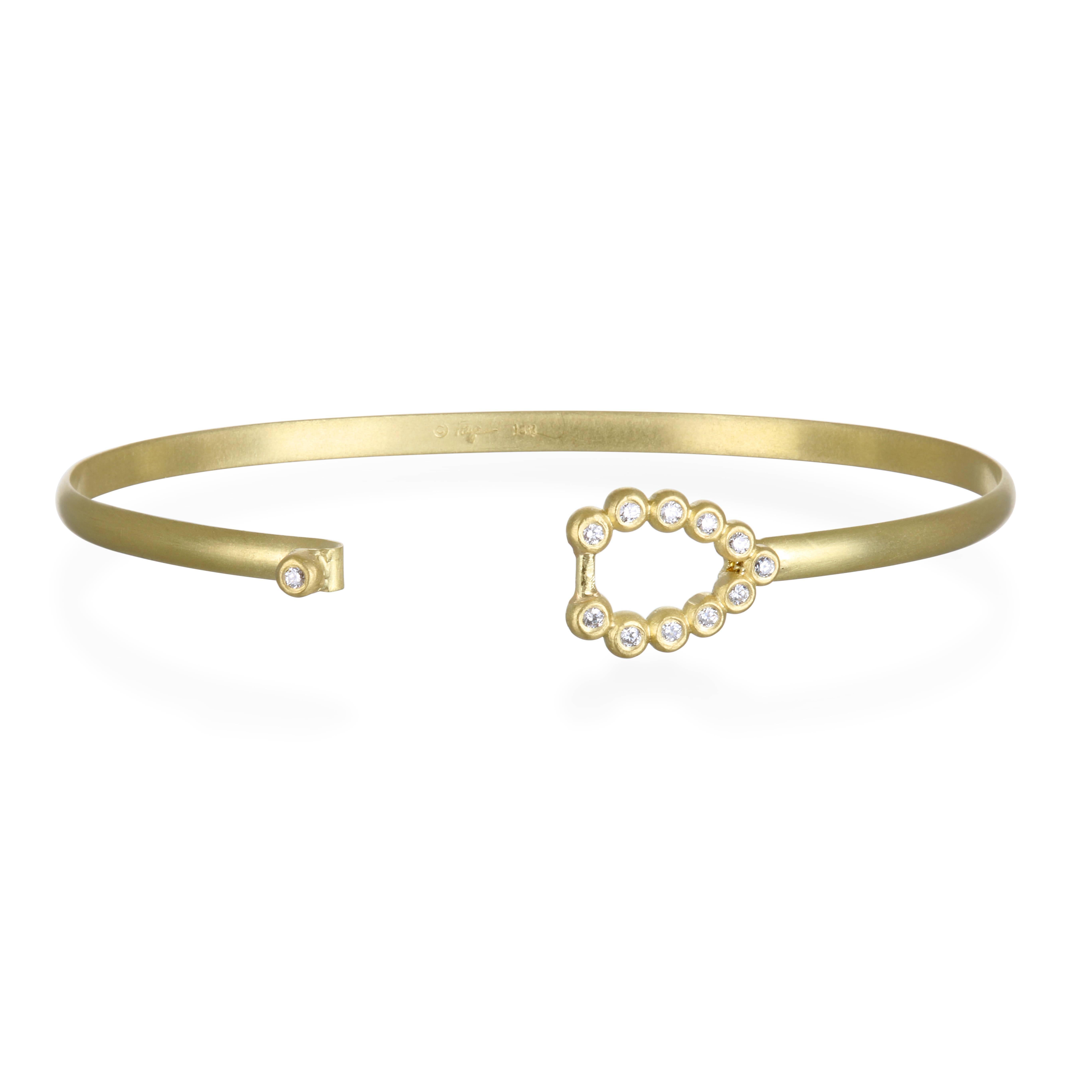 Understated beauty!  Handcrafted in 18k gold, the teardrop diamond bangle is perfect to wear on its own or great to stack with other bangles.  

 2.25"  Inner Diameter
Diamonds  .29 carats twt