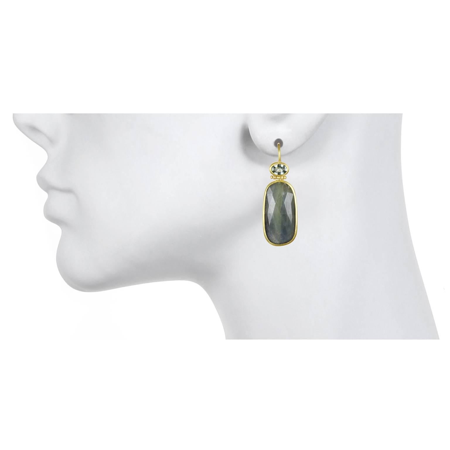 Handcrafted in 18k gold, rose cut blue-green sapphire slices are bezel set and are accented with blue-green faceted sapphires. A great addition to any jewelry wardrobe to create your own unique style! French Ear Wires 

Metal: 18K Green Gold, Matte