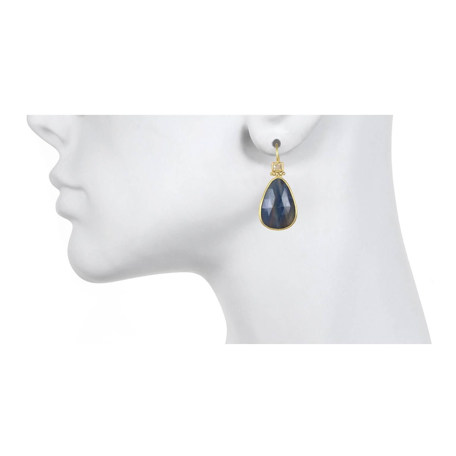 For those who appreciate items that are truly unique, these earrings are it!  Handcrafted in 18k gold, rose cut blue sapphire slices are bezel set and paired with diamond baguettes. The hinged diamond baguettes contrast and add a sparkle to the