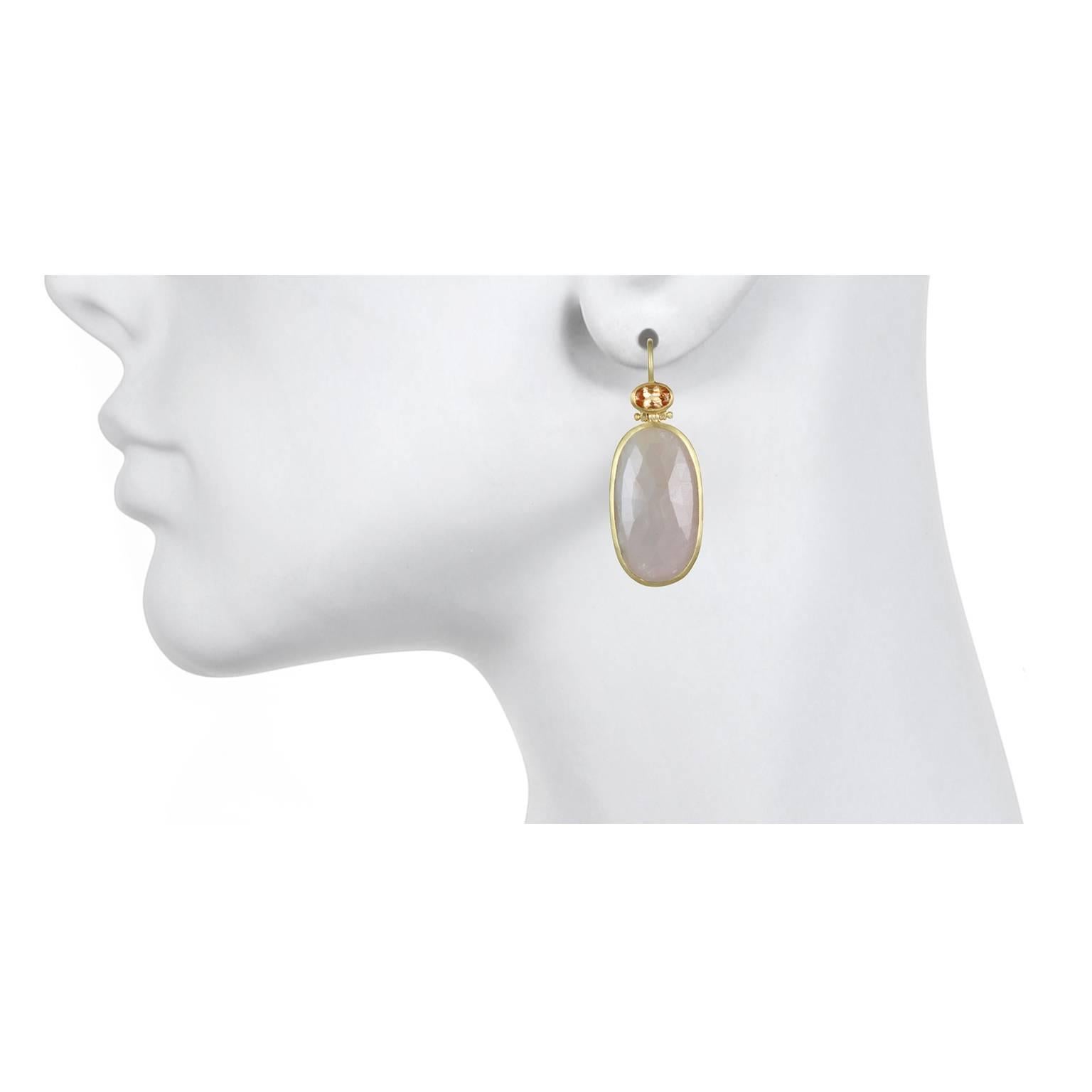 For those of us who appreciate and covet items that are truly unique, these earrings are it!  Handcrafted in 18k gold, blush-pink sapphire slices are bezel set and paired with faceted oval Imperial Topaz. The perfect complement adding color and