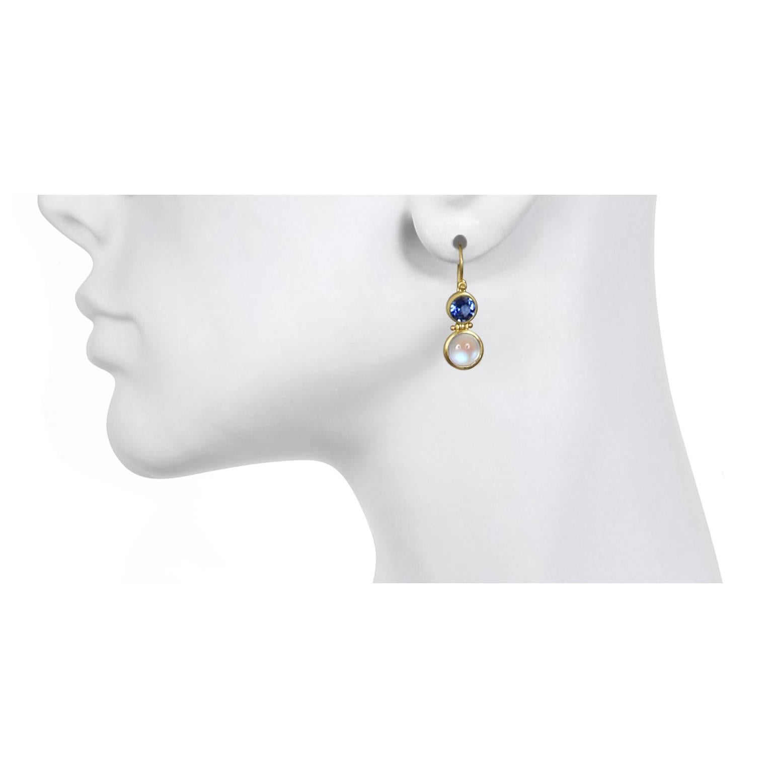 Exquisite and eye-catching, these uniquely designed earrings are handcrafted in18k gold.  Ceylon Moonstone cabochons are paired with vivid blue  Ceylon Sapphires in Faye Kim's signature double hinge design. 

Sapphire 1.01 carats twt
Moonstone 3.05