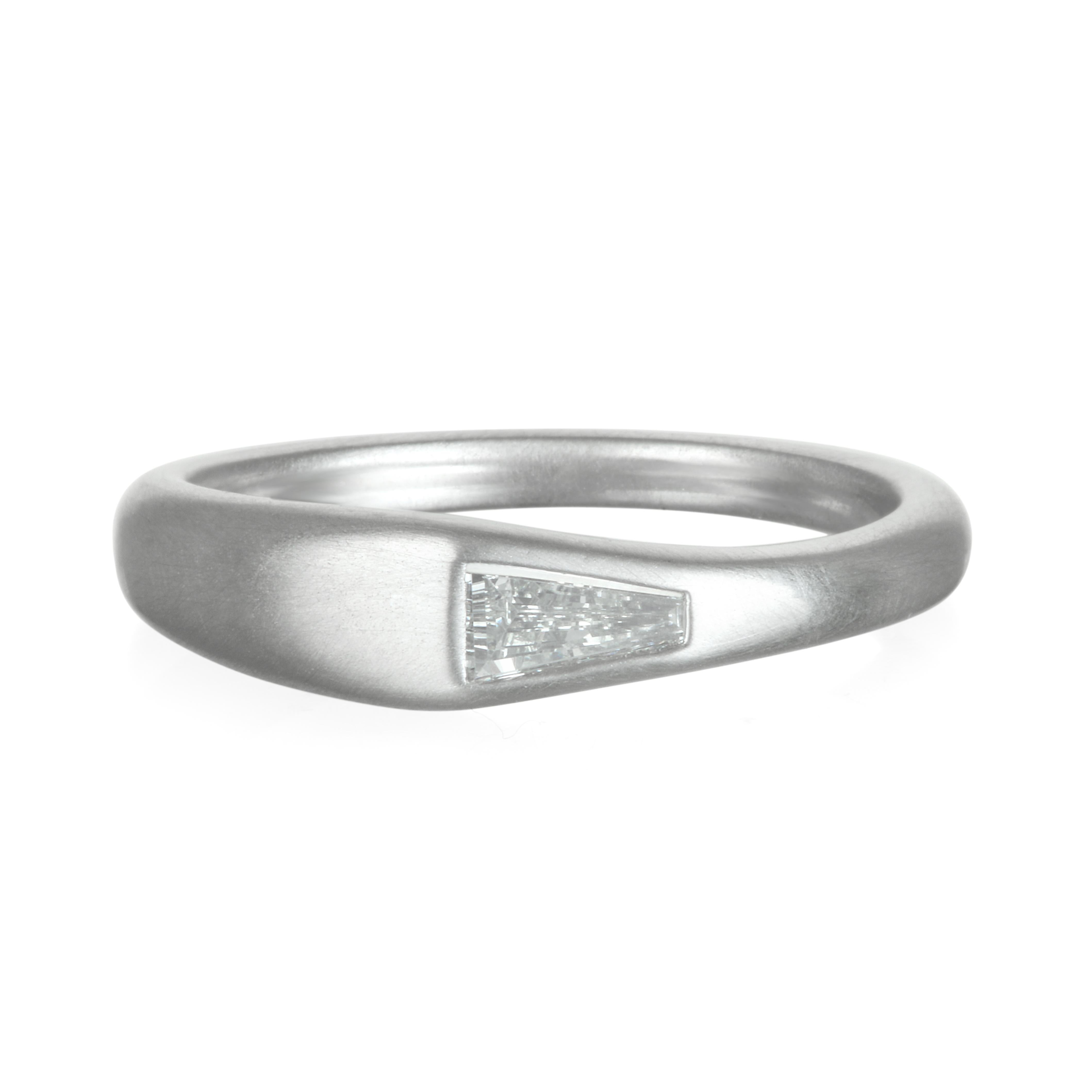 Faye Kim's handcrafted  Platinum diamond ring, set with a tapered baguette diamond is perfect on its own for the modern and minimalistic.  If you prefer to stack, layer it with diamond eternity bands to create our own unique style. 
Size