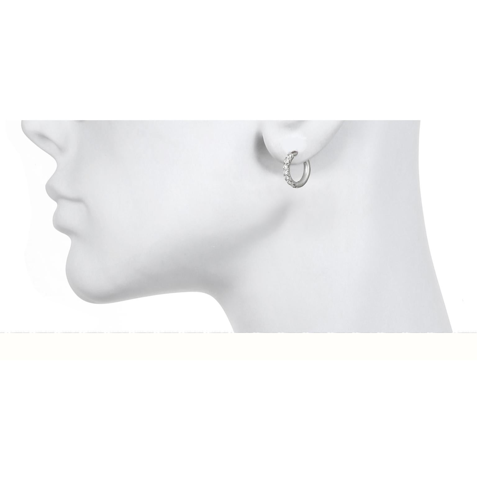 These handcrafted platinum huggy hoops are your go-to earrings. Whether you're headed for a girls night out or conducting the next PTA meeting, these earrings a perfect fit.  Matte platinum enhances the bright sparkle of the diamonds and conveys