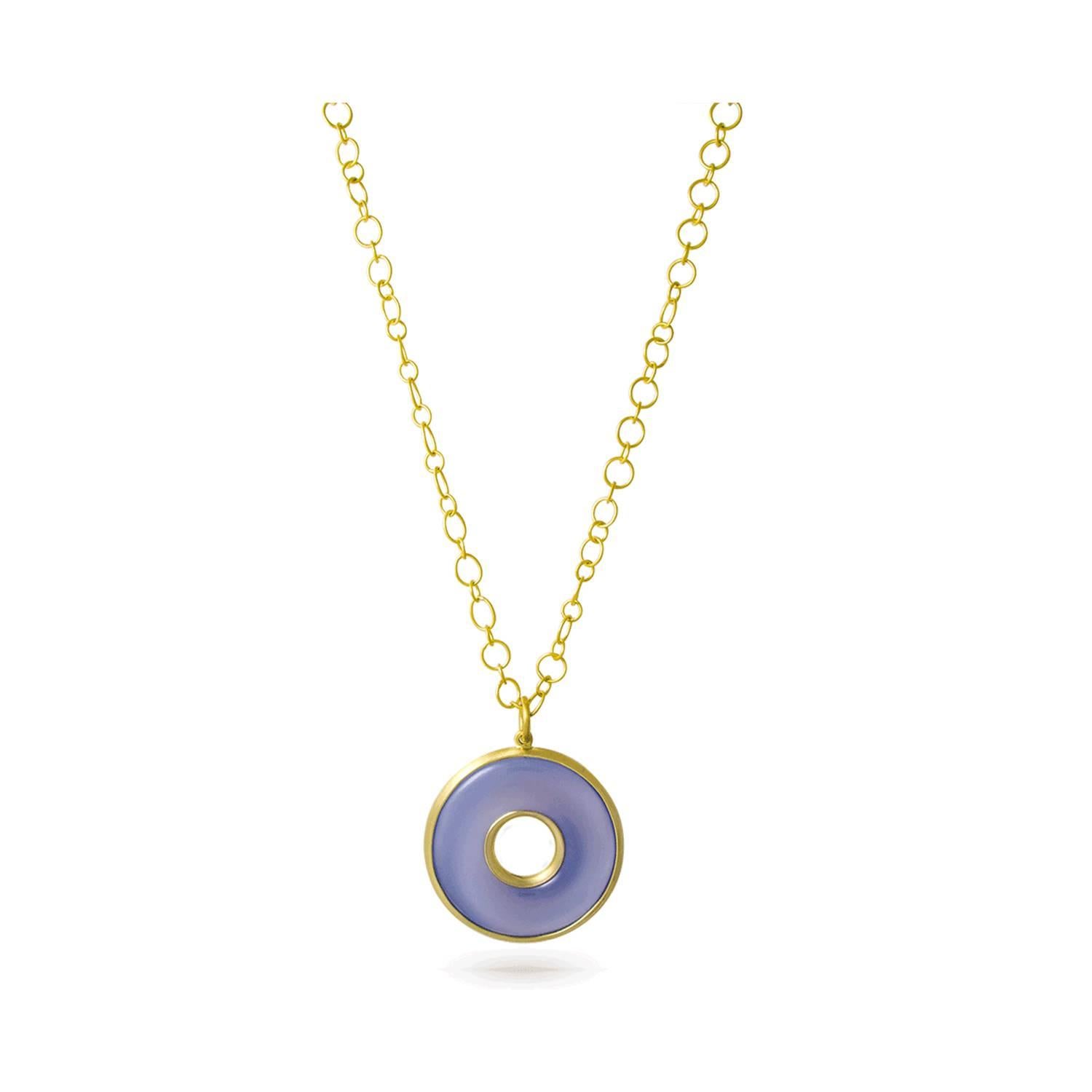 Circle of Life pendant in a soft shade of blue-gray chalcedony is custom cut and hand-framed in 18k gold.   Blue Chalcedony, a member of the quartz family has a quality that is translucent and ethereal invoking calm and peace. Featured on a handmade