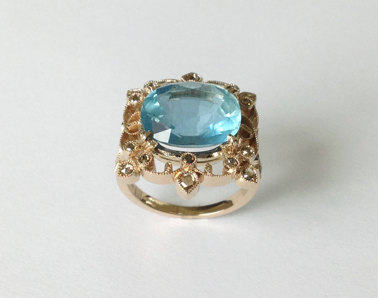Dalben design Aquamarine and brown Diamond Ring mounted in 18 kt white gold.
One Oval cut Aquamarine weighting 6,12 carat and 22 rose cut brown Diamonds weighting 0,45 carats.
Ring size 7 1/4 USA - 55 EU resizable to most finger sizes. 
The Ring