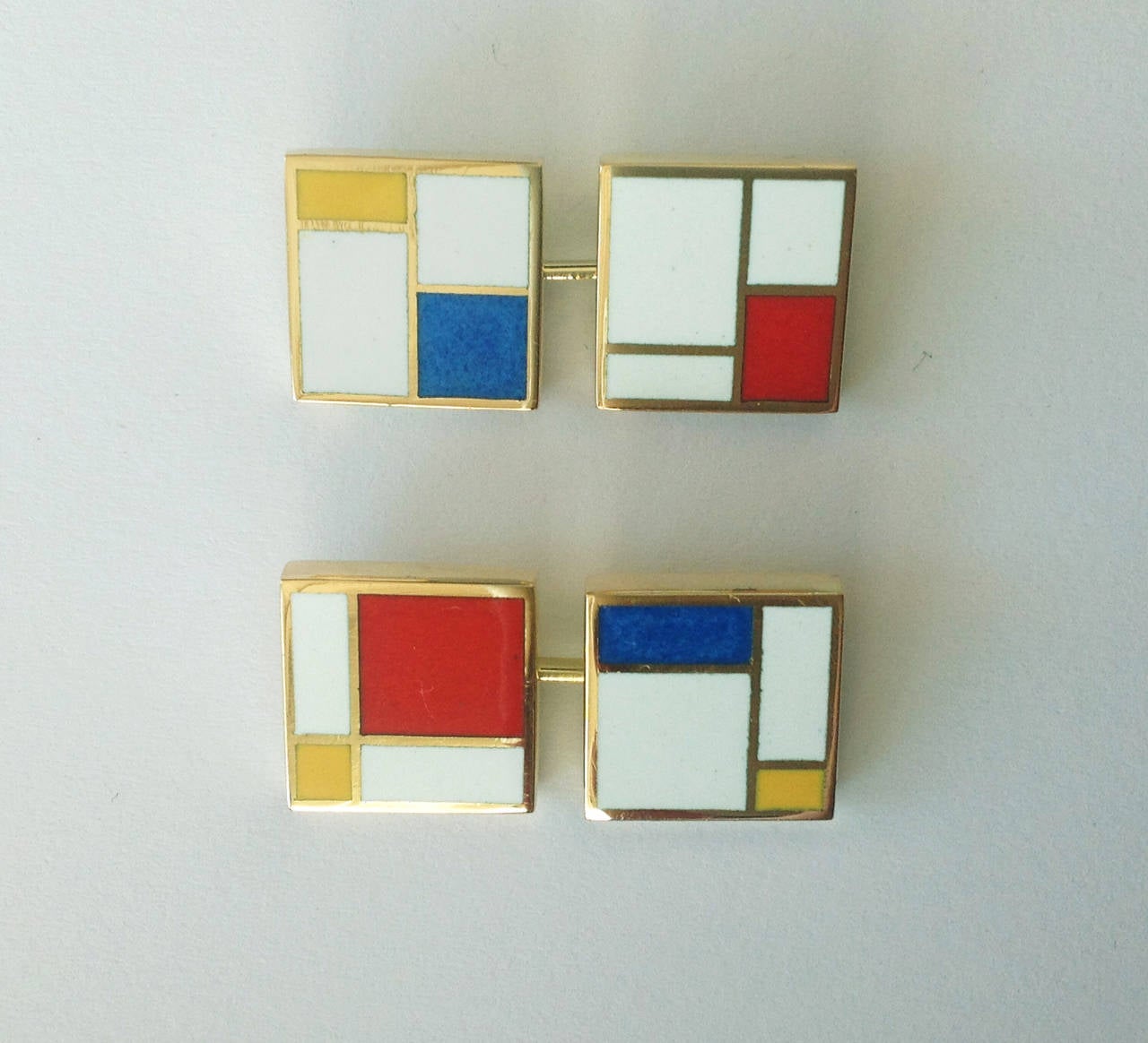 Dalben design fire Enamel and 18 k yellow gold cufflinks 0,5 x 0,5 in. inspired by Mondrian paintings.
The cufflinks are completely hand made in our atelier in Como, Italy, with rigorous quality workmanship .