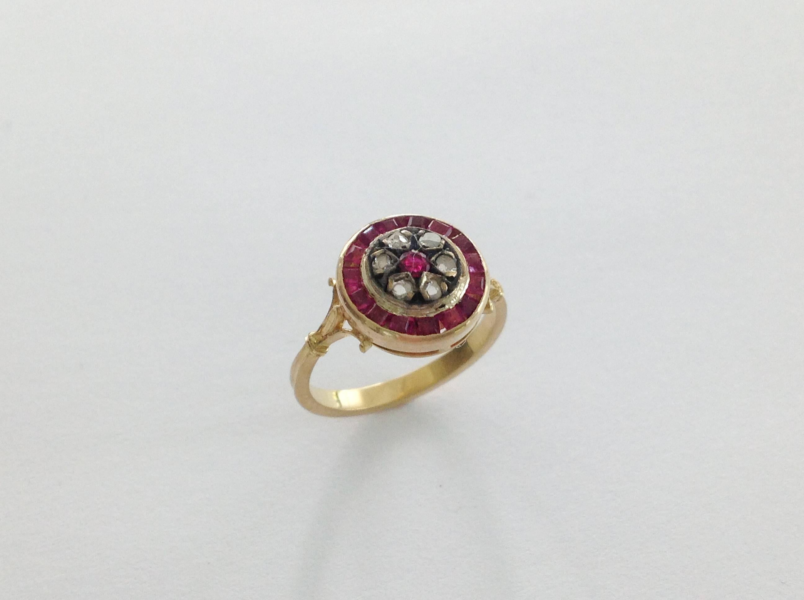 Ruby and rose cut diamond 18 k yellow gold and silver ring .
Circa 1920.
The ring shank has been completely restored.
Ring size 5 1/4 USA , 50 UE resizable