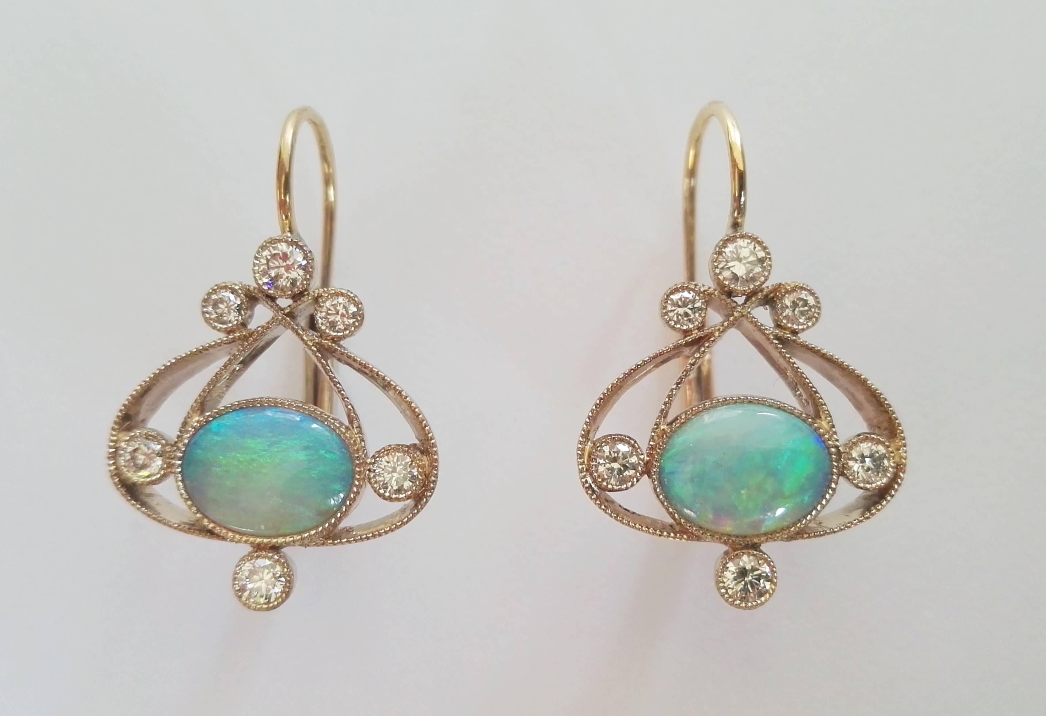 Dalben design Opal earrings with 2 Australian Opals weighing 1,4 carats and 12 white round brillant cut Diamonds weighing 0,40 carats mounted in 18 kt warm white gold.
Dimension:
width 14,9 mm
height without leverback 16,7 mm
The earrings has