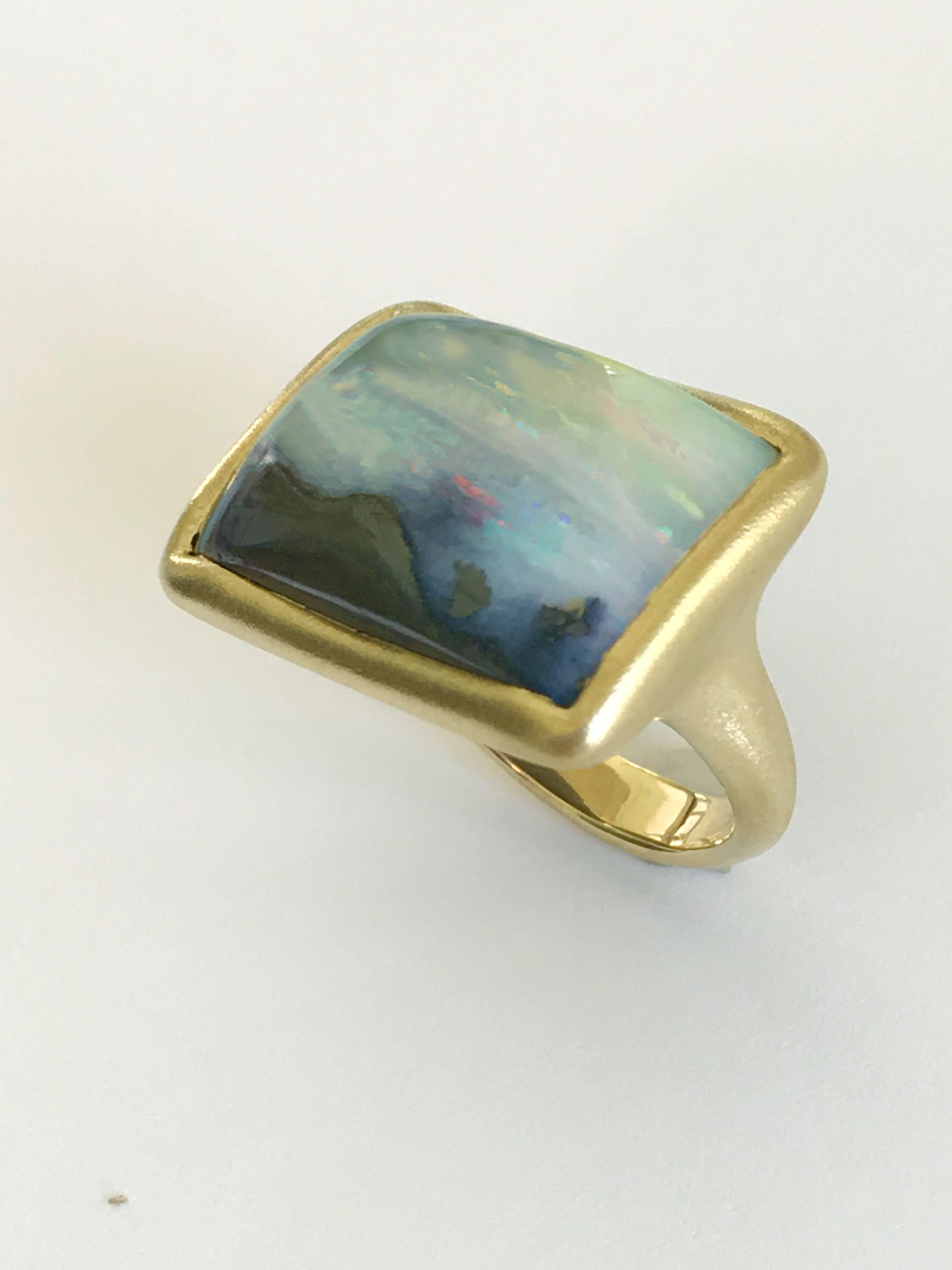 Dalben design One of a kind 18k yellow gold matte finishing ring with a ct. 19,45 bezel-set Boulder Opal. 
This Australian Boulder Opal looks like a sunrise landscape. 
Ring size 7 1/4 USA - 55 EU re-sizable to most finger sizes.  
Bezel setting