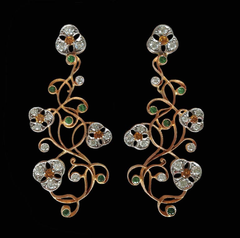 Dalben design Diamonds and tsavorite garnet chandelier floral earrings mounted in 18 kt white and rose gold with 30 white round brillant cut diamonds total weight 0,79 carats , 8 orange round brillant cut diamonds weight 0,34 carats , 12 green
