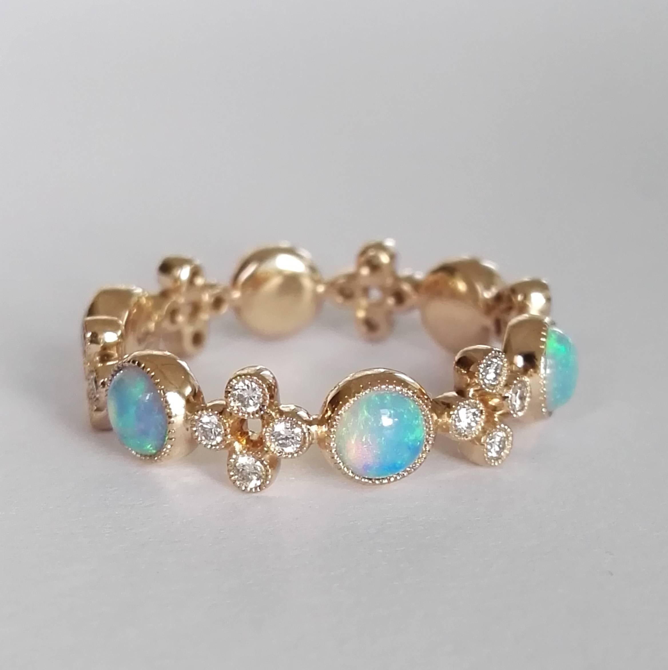 Dalben design Opal band ring with 6 Australian Opals and 24 white round brillant cut Diamonds weighing 0,24 carats mounted in 18 kt warm white gold. 
Ring size 6 1/2 USA - 53 EU .  
The Ring has been designed and handcrafted in our atelier in Como