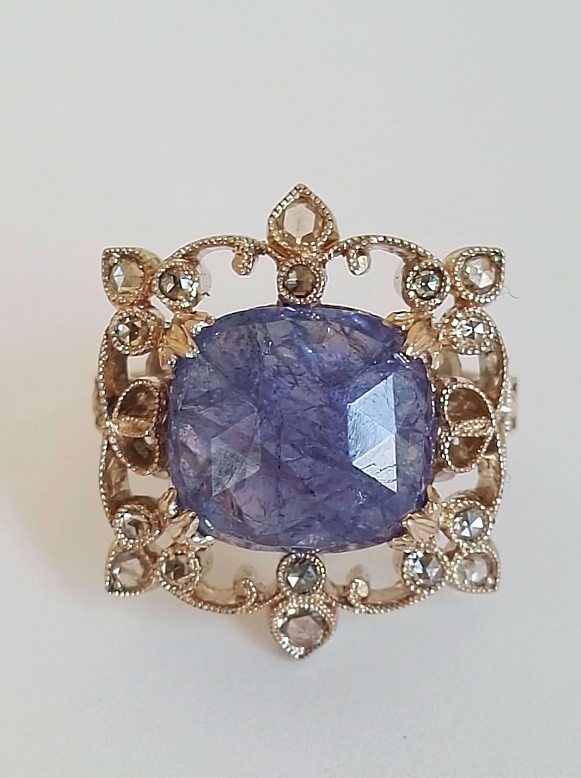 Dalben design Tanzanite and brown Diamond Ring mounted in 18 kt white gold. One Oval cut Tanzanite weighting 6,32 carat and 22 rose cut brown Diamonds weighting 0,45 carats. Ring size 7 1/4 USA - 55 EU resizable to most finger sizes. 
The Ring has