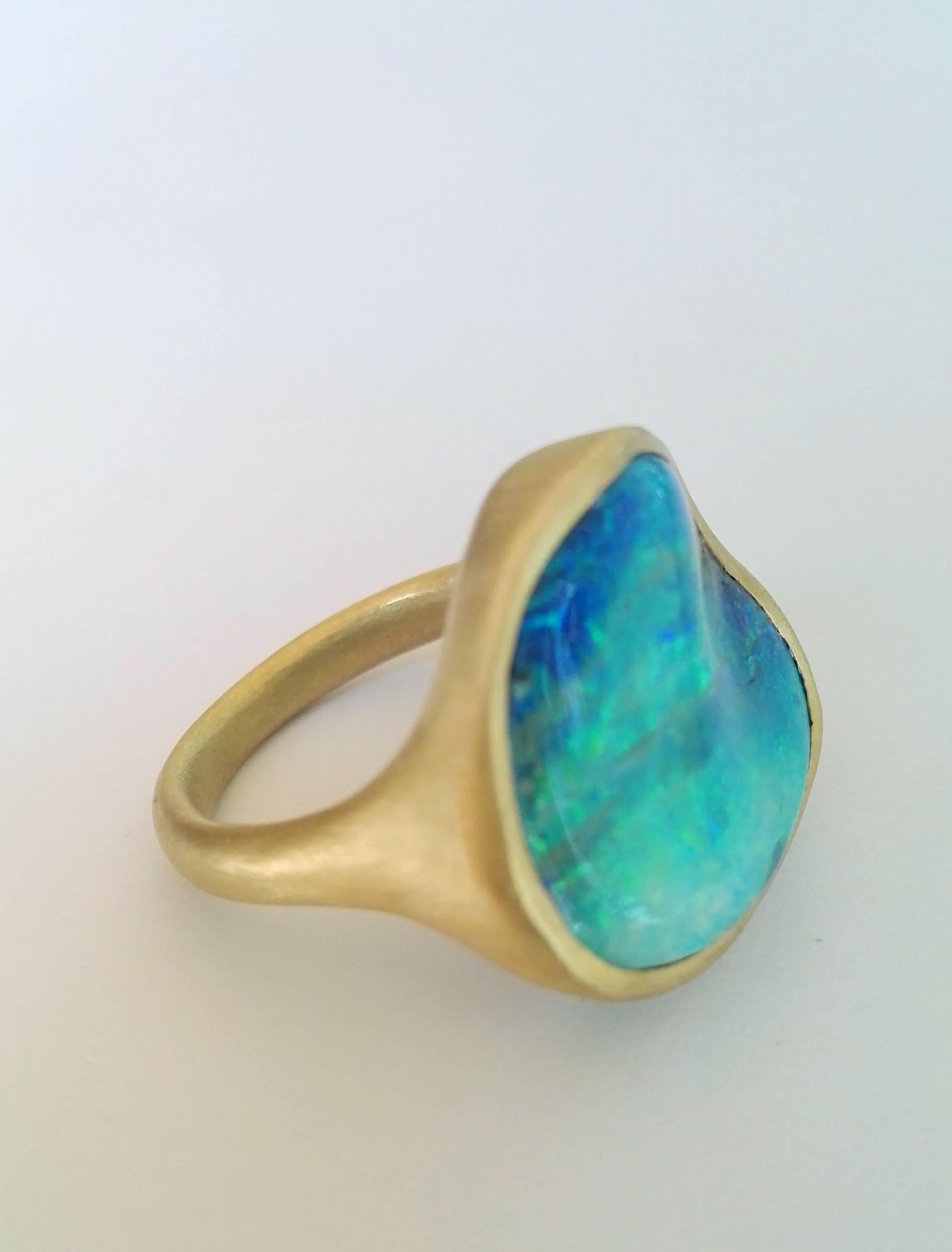 Dalben design One of a kind 18k yellow gold satin finishing ring with a 8.06 carat bezel-set magnificent Boulder Opal.
This Australian Bouder Opal seems the Sardinia sea.
Ring size 7  1/4  - EU 55 re-sizable to most finger sizes.
The Ring has