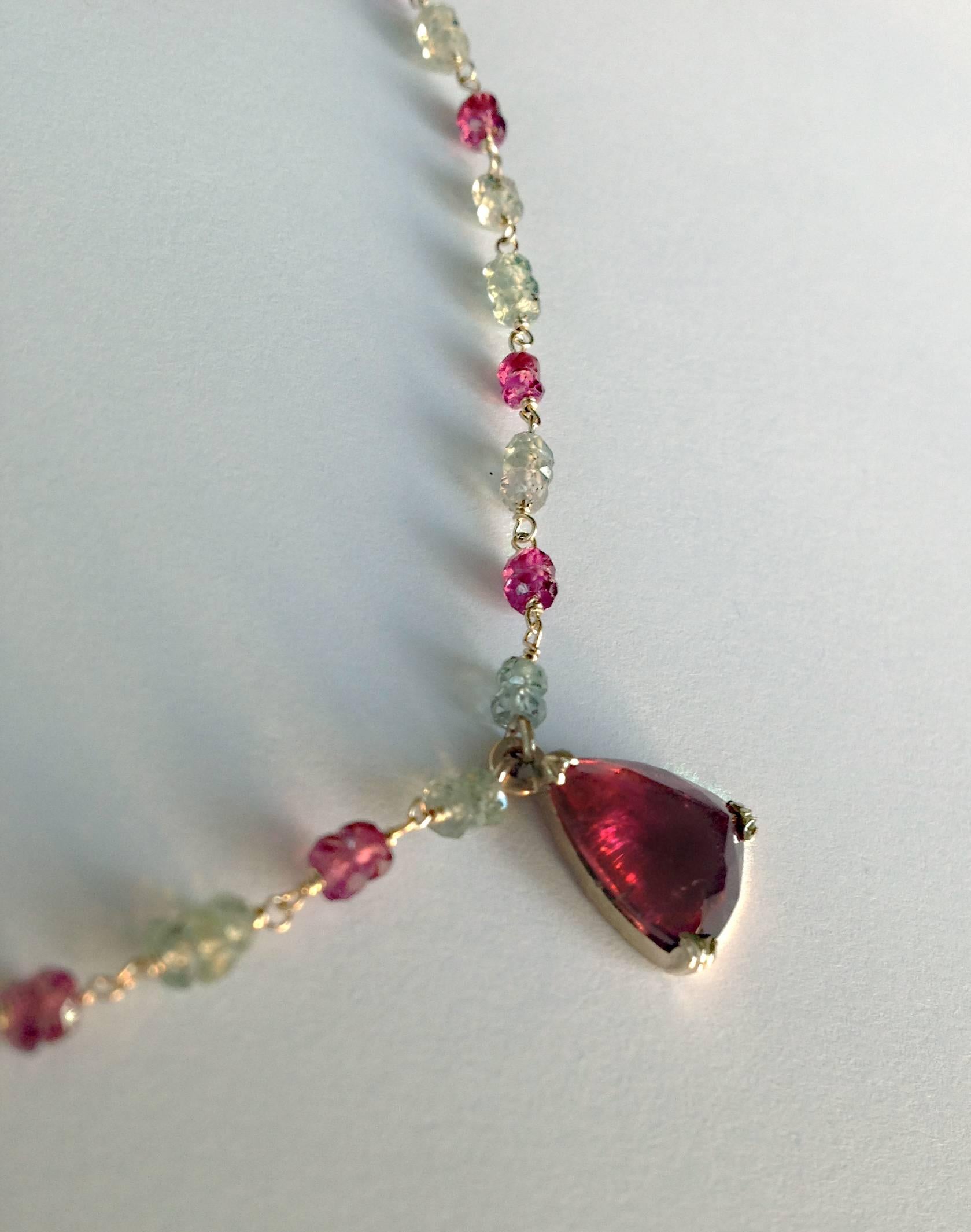 Dalben design hand crafted necklace composed of a pear cut red tourmaline ( Rubelite ) mounted on a white gold 18k rosary-style chain with faceted green and red sapphire beads  spaced at even intervals . 
Green and red sapphire beads dimension: 2,9