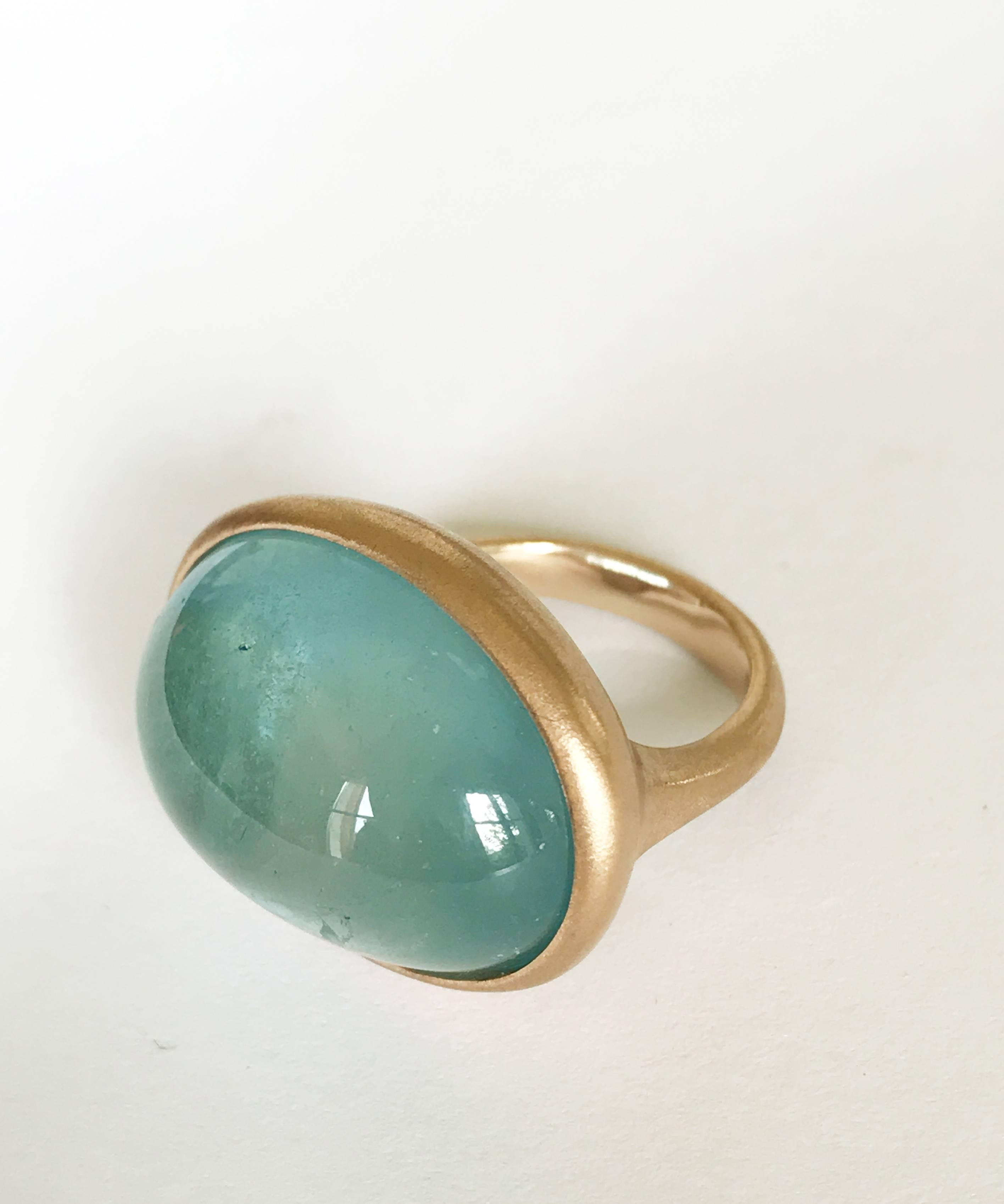 Dalben design One of a Kind 18k rose gold matte finishing ring with a  magnificent slightly foggy 32 carat bezel-set cabochon cut Aquamarine. 
Ring size 6 3/4 - EU 54 re-sizable to most finger sizes.  
Bezel stone dimensions :  
width 25 mm  
height