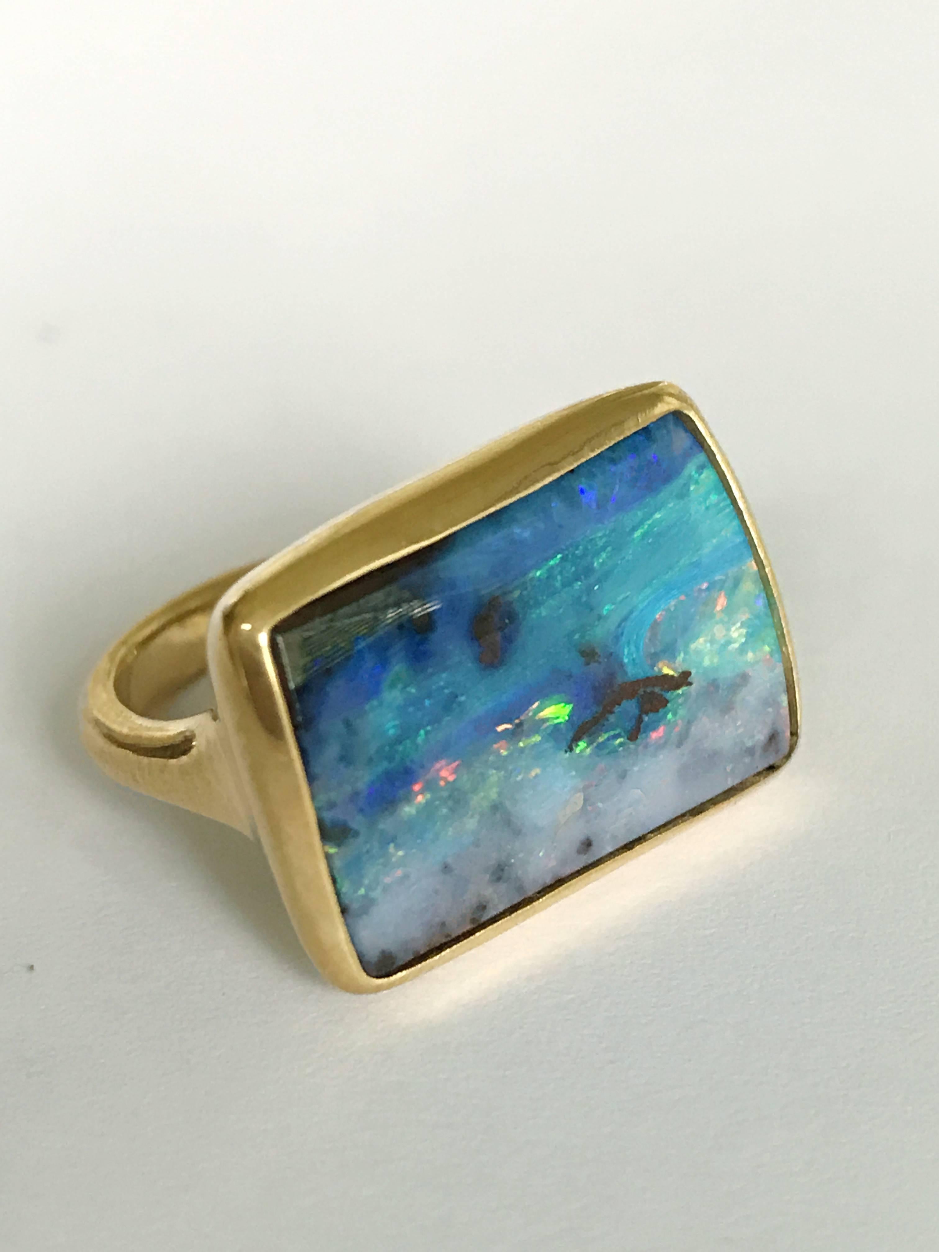 Dalben design One of a kind 18k yellow gold matte finishing ring with a 16,21 carat bezel-set wonderful Boulder Opal. 
This Australian Boulder Opal has magnificent Ocean colors 
Ring size 6 3/4 US - 54 EU re-sizable to most finger sizes. 
Bezel