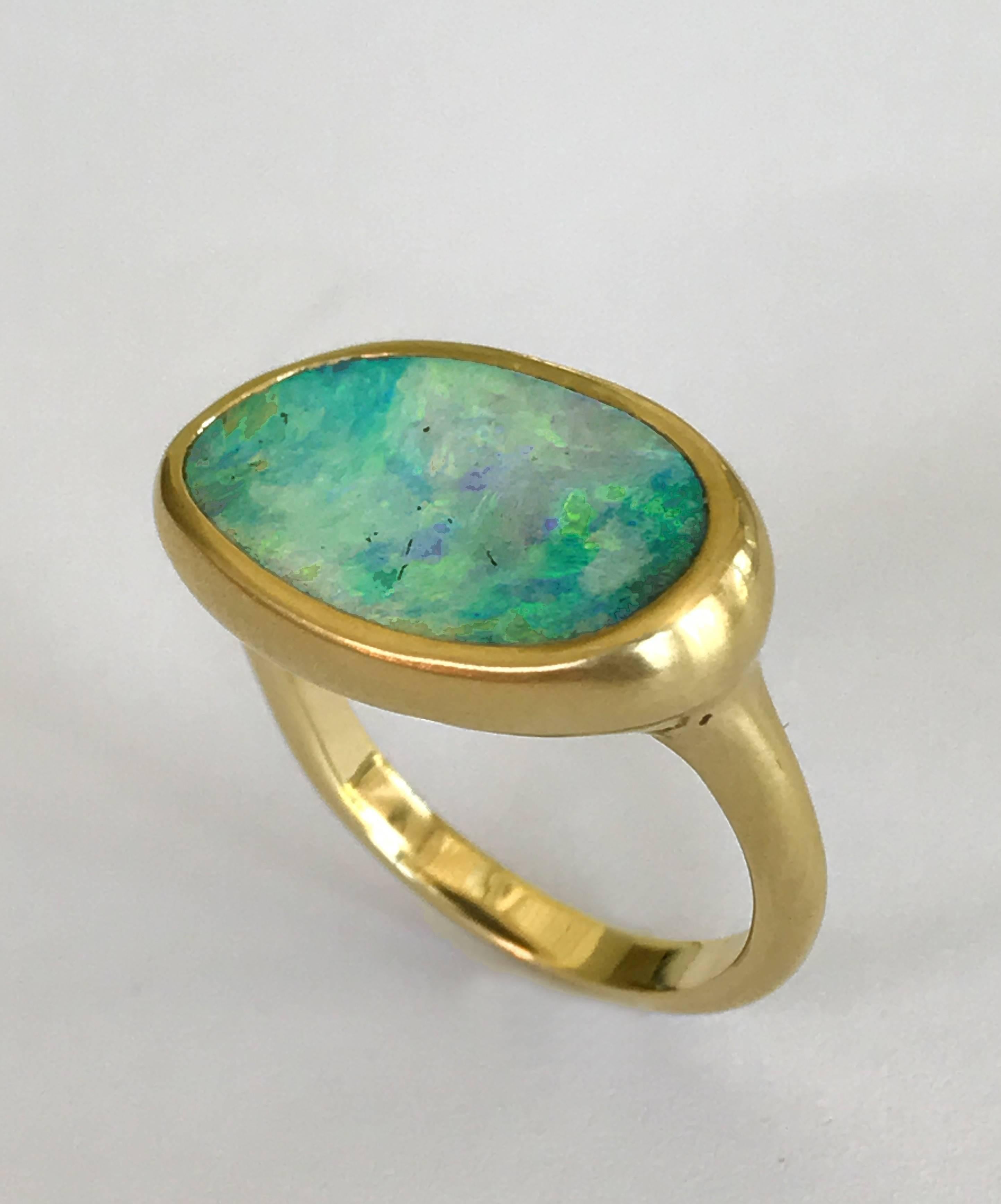 Dalben design One of a kind 18k yellow gold matte finishing ring with a 5,44 carat bezel-set lovely Australian Boulder Opal. 
The stone colors looks like a Sardinia bay sea . 
Ring size 6 3/4 - EU 54 re-sizable to most finger sizes. 
Bezel setting