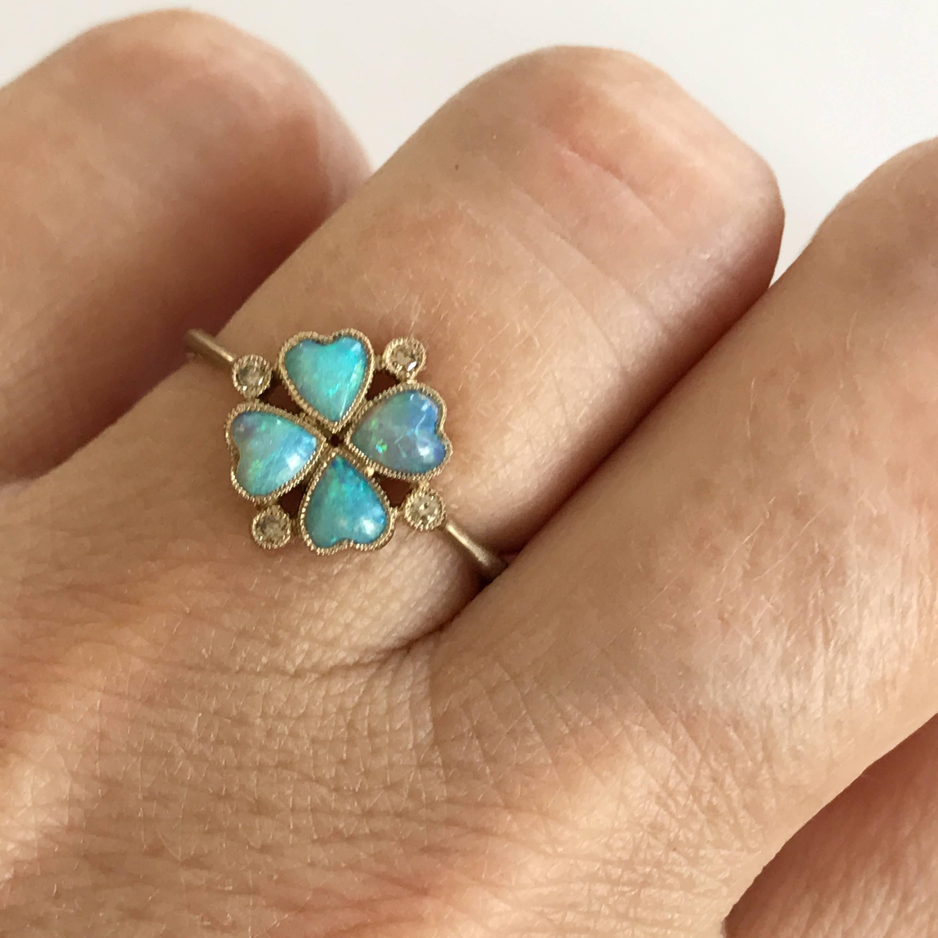 Dalben design four-leaf clover Australian Opals little ring with 4 heart shape Australian Opals and 4 light brown round brilliant cut Diamonds weighing 0,04 carats mounted in 18 kt warm white gold.   
Four-leaf clover dimension: 9,4 mm. 
Ring size 5