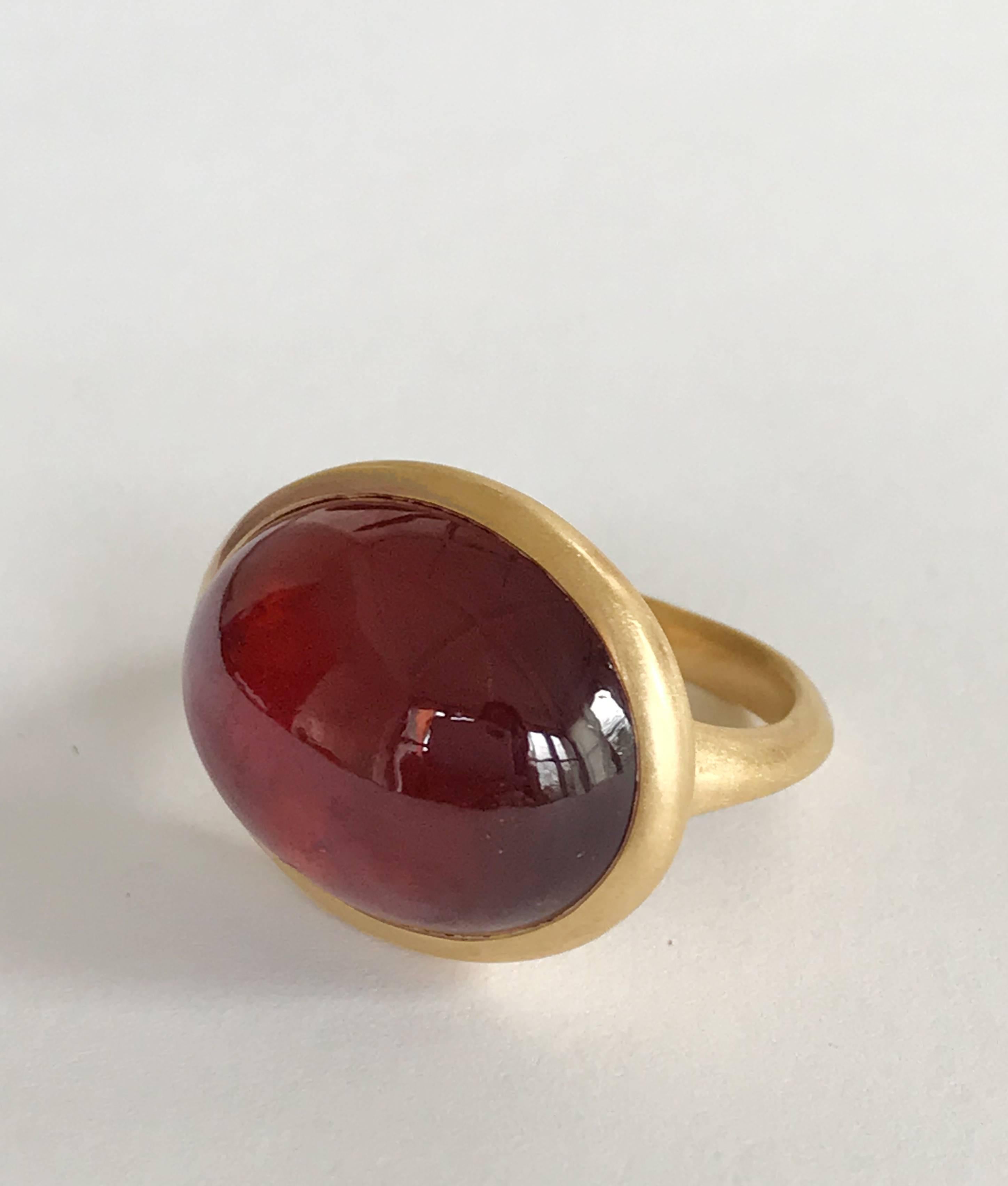 Dalben design 18k yellow gold matte finishing ring with a deep reed 24 carat bezel-set oval cabochon cut Hessonite Garnet. 
Ring size US 7 1/4 - EU 55 re-sizable to most finger sizes. 
Bezel stone dimensions : width 22,8 mm height 18,4 mm 
The ring