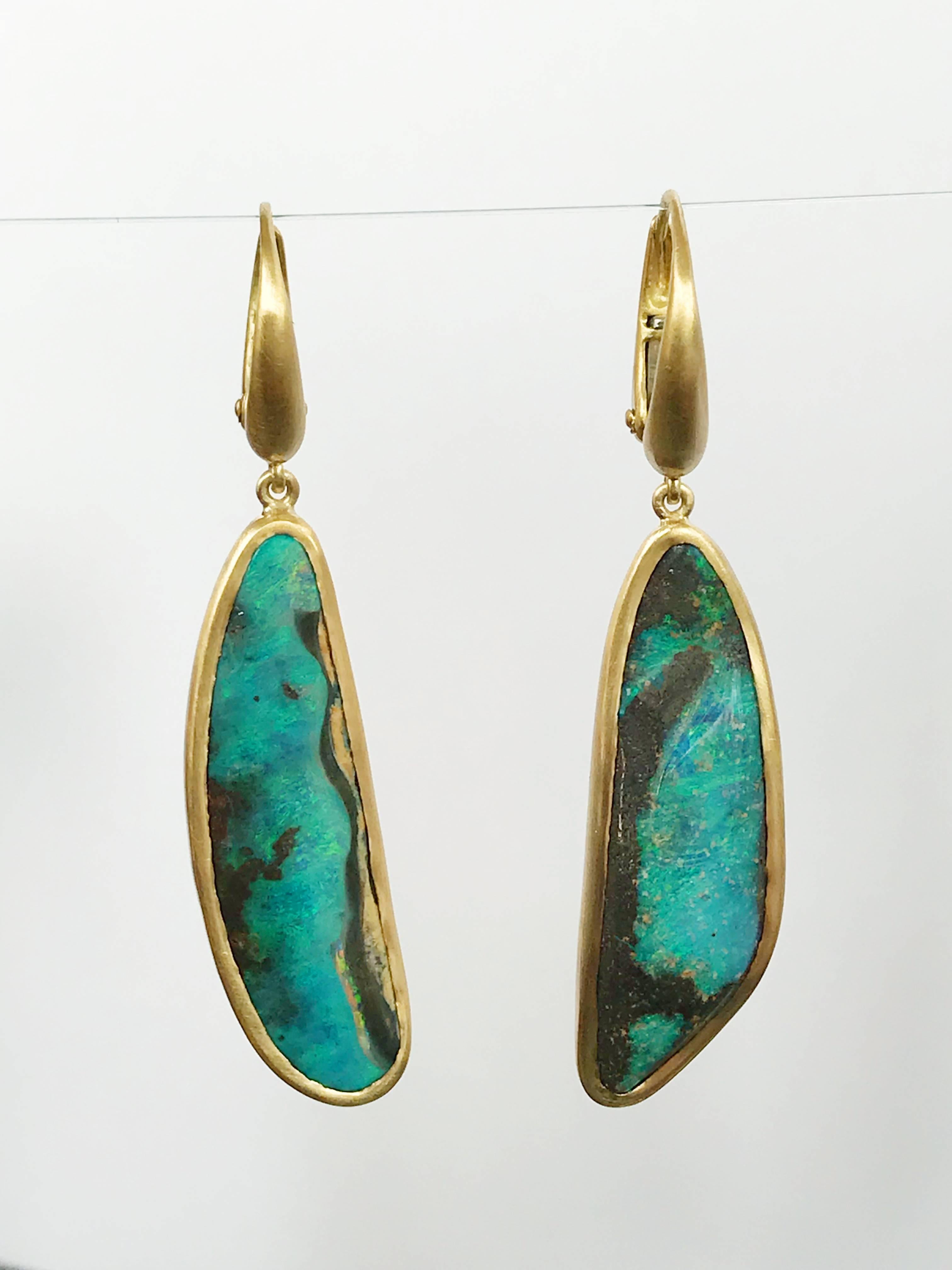 Dalben design One of a kind 18k yellow gold semi lucid finishing dangle earrings with two deep blue bezel set Australian Boulder Opals weighing 17,10 carats.  
This Australian Boulder Opals has magnificent Mediterranean sea colors 
Opal Dimension