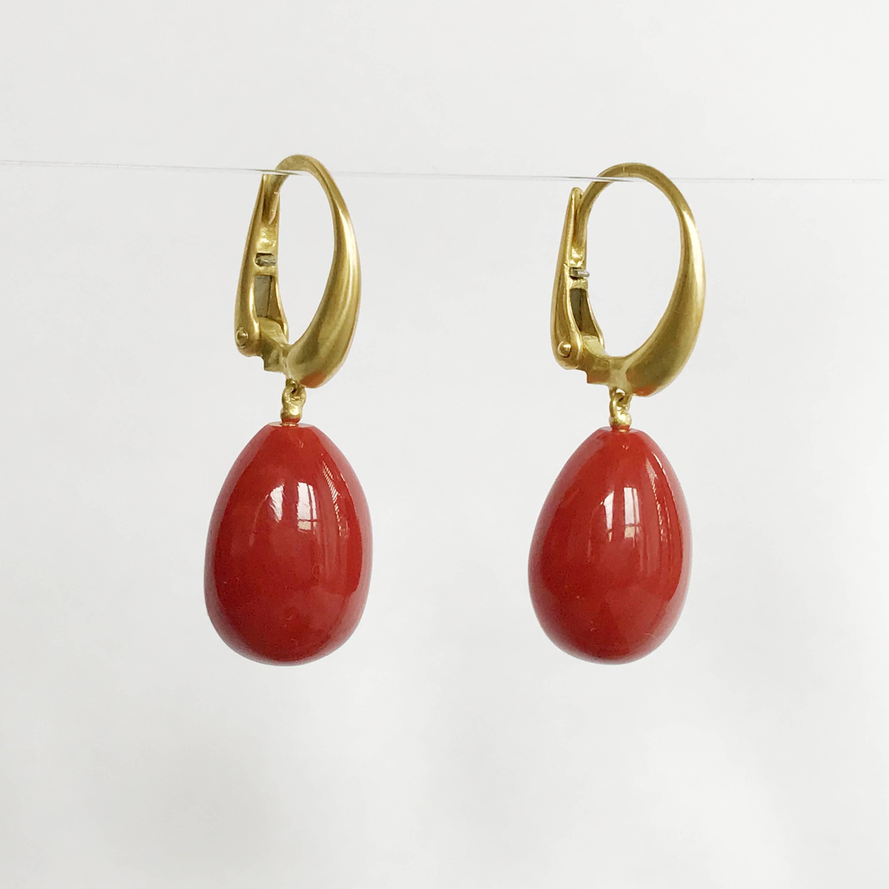Dalben design 18 kt semi-lucid finished yellow gold earrings with two drop shape Mediterranean Red Coral 11,8 x 15 mm  weight 24,3 carat . 
Earring dimension :  
width 11,8 mm 
height with leverback 31,8 mm  
The earrings has been designed and