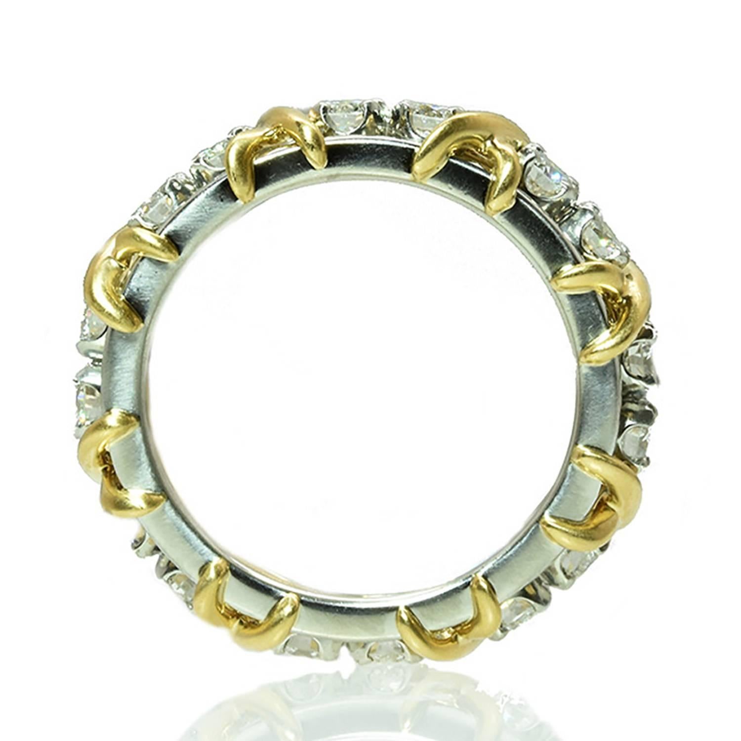 A classic sixteen stone ring by Jean Schlumberger for Tiffany & Co. The ring features 16 round brilliant cut diamonds totaling approximately 1.12 carats. The ring is platinum and 18k Yellow Gold, and signed by Tiffany & Co. Size 4 3/4.