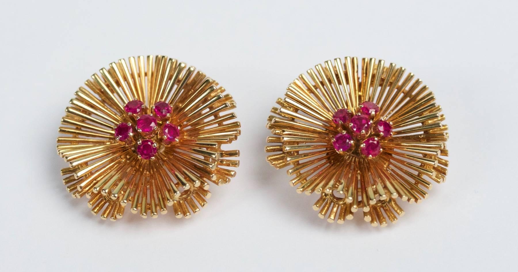 A pair of 18K gold and ruby earclips. French work. Circa 1950.