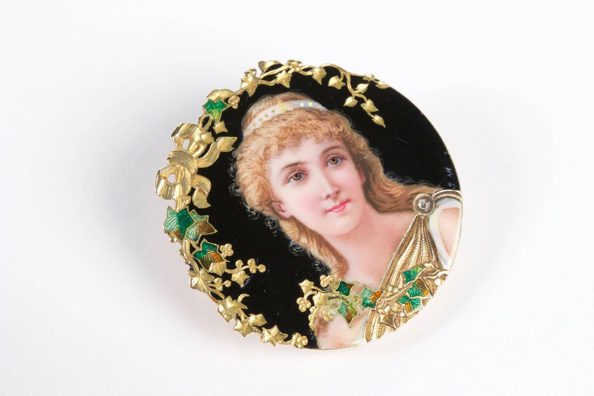 Art Nouveau 18k enameled yellow gold miniature portrait brooch set with diamond rose cut. Circa 1900.