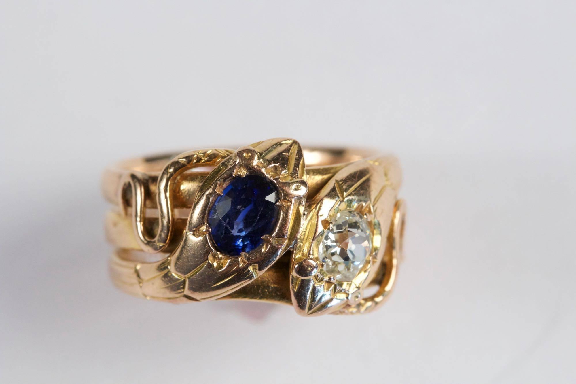 Antique 18k pink gold double headed Snake ring set with diamond old cut (approximately 0.50 carats ) and sapphire (approximately 0.60 carats). Circa 1870. French work.
Size 6  1/2  (54)