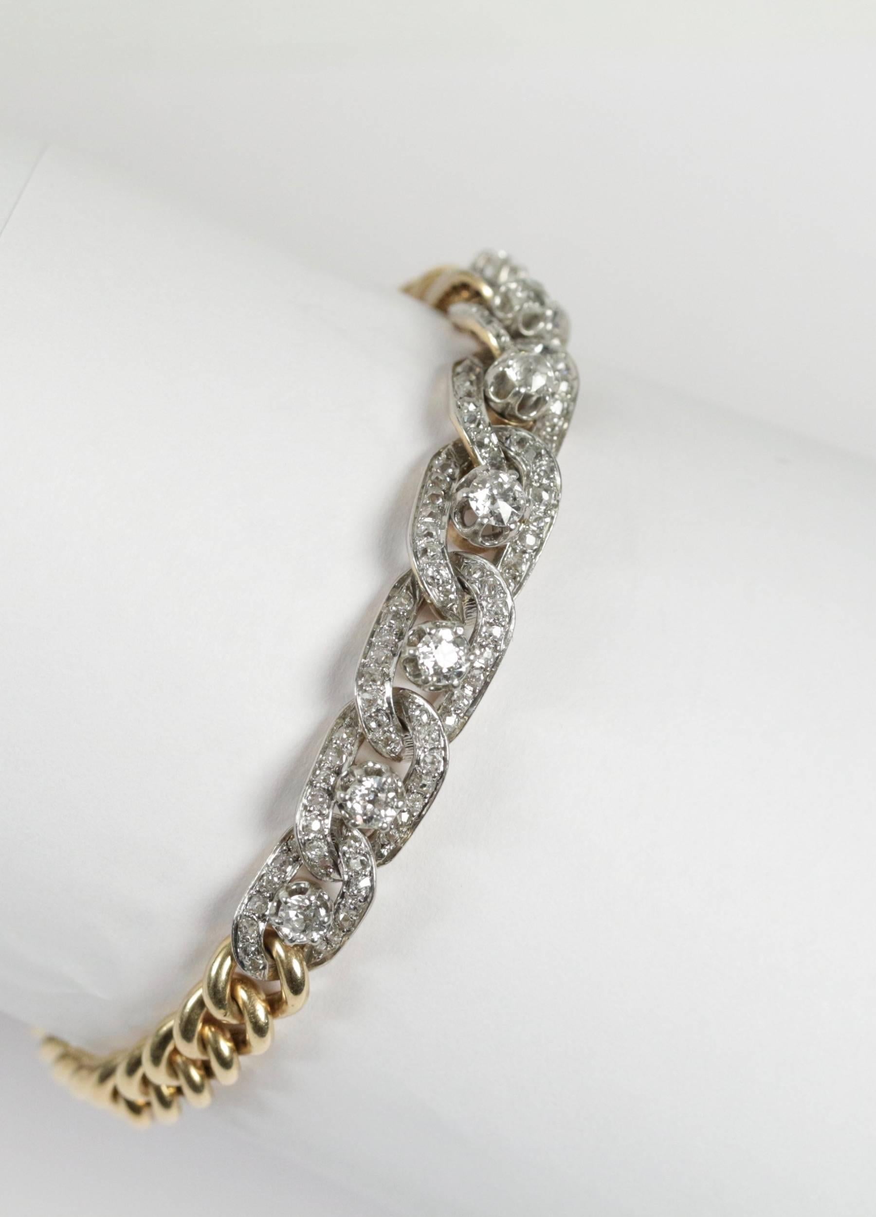 18k yellow gold and platinum link bracelet set with brillant cut diamonds (approximate total weight estimated to 4ct). 

