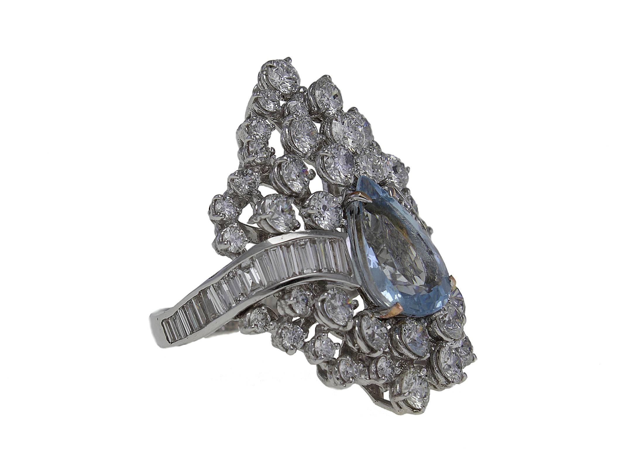 Shiny ring in 14 Kt white gold covered in diamonds and baguette cut diamonds that surround a central aquamarine drop.

diamonds  4.18kt
baguette cut diamonds 1.45kt
aquamarine  3.3kt  
tot weight 13.8gr
US Size
Width 0.98 in
Length 1.37 in
Diameter